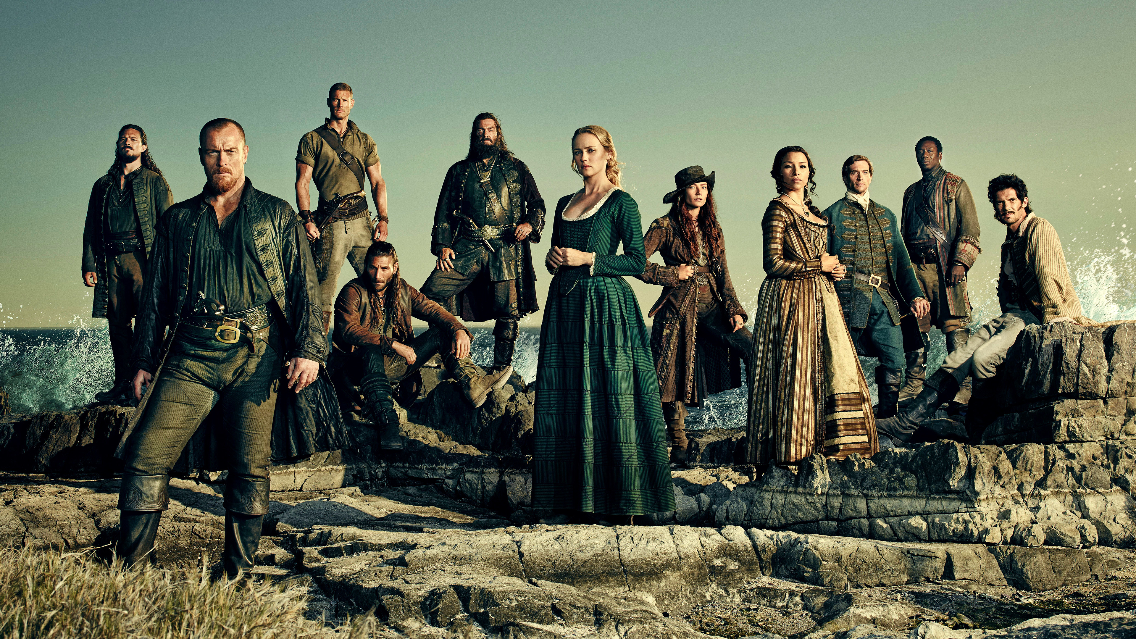 Cast of Black Sails on rocks by the sea HD Wallpaper