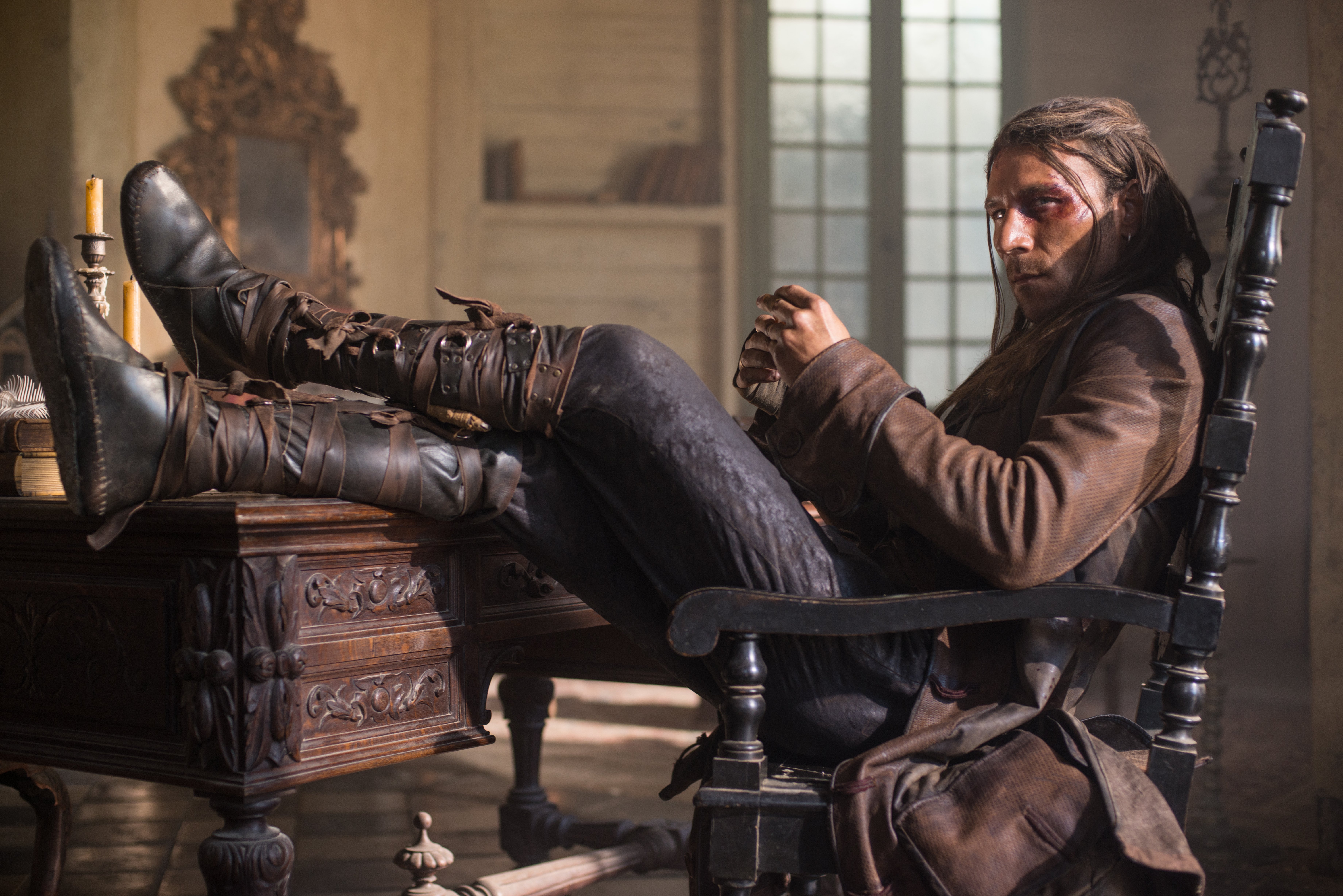 Zach McGowan in a chair HD Wallpaper