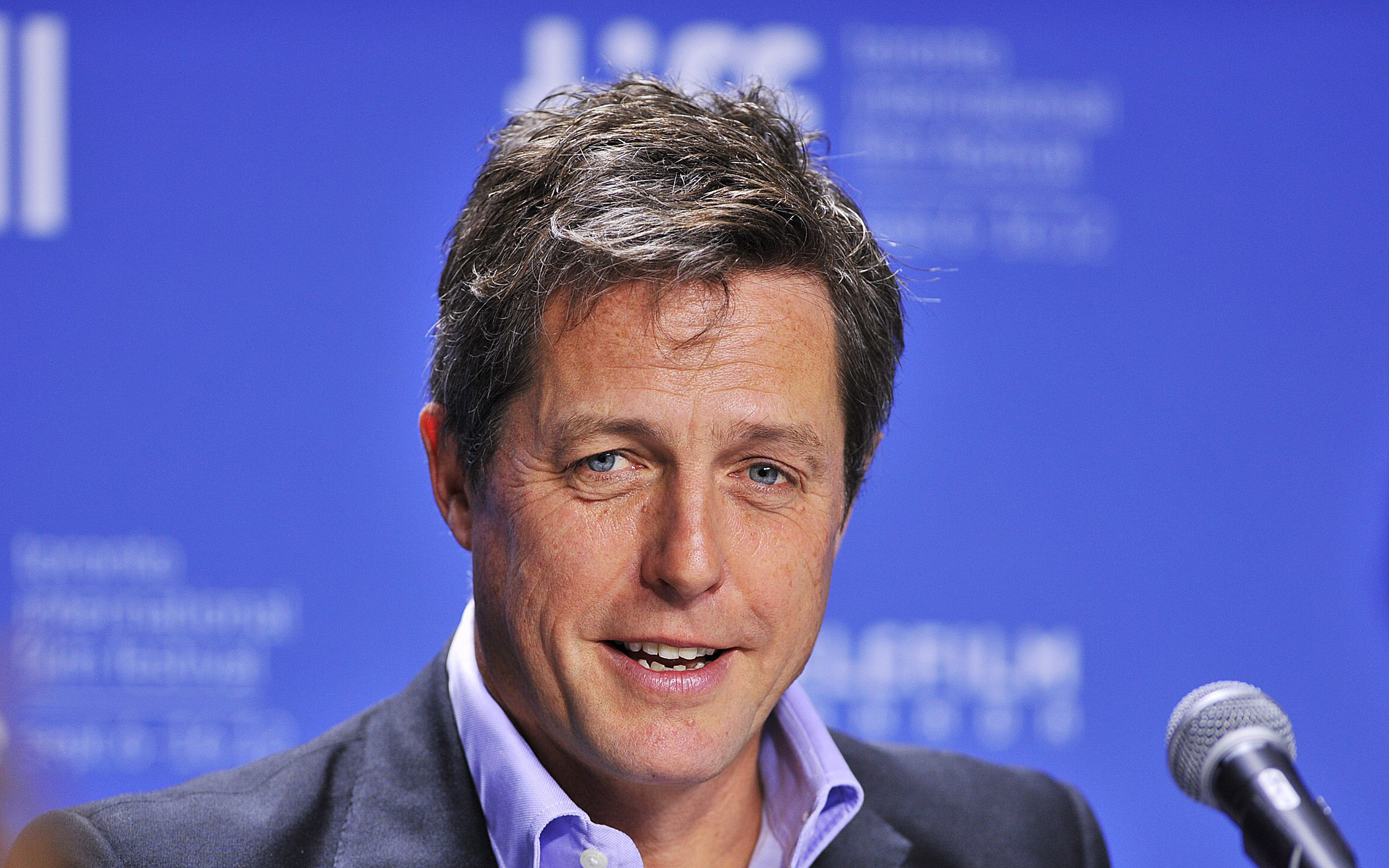 Hugh Grant at a press conference HD Wallpaper