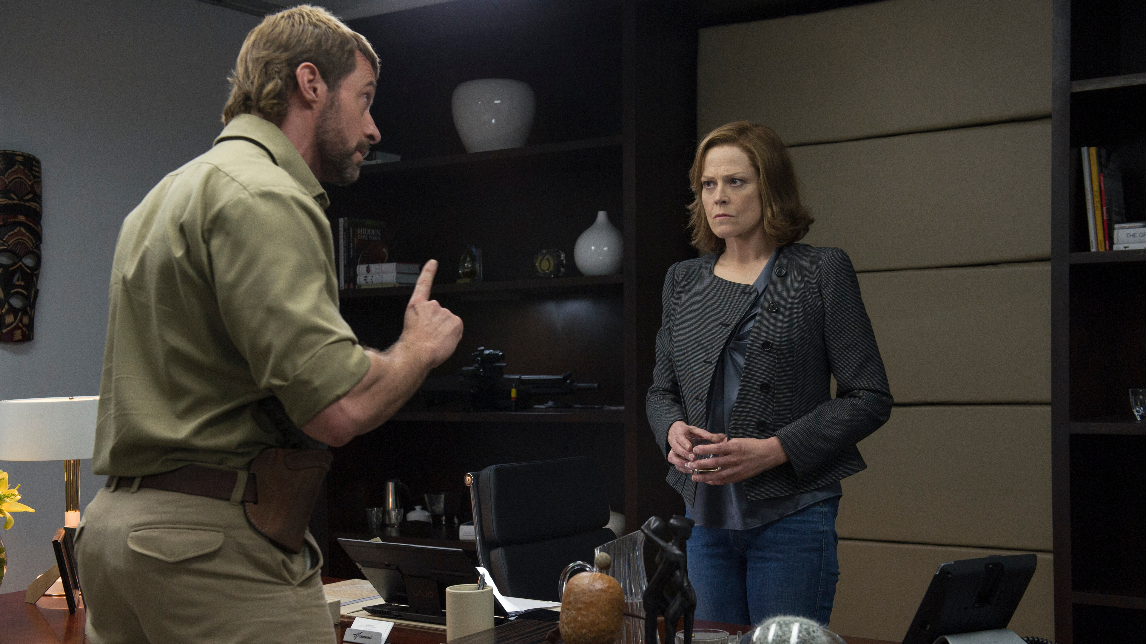 Sigourney Weaver and Hugh Jackman in an office HD Wallpaper