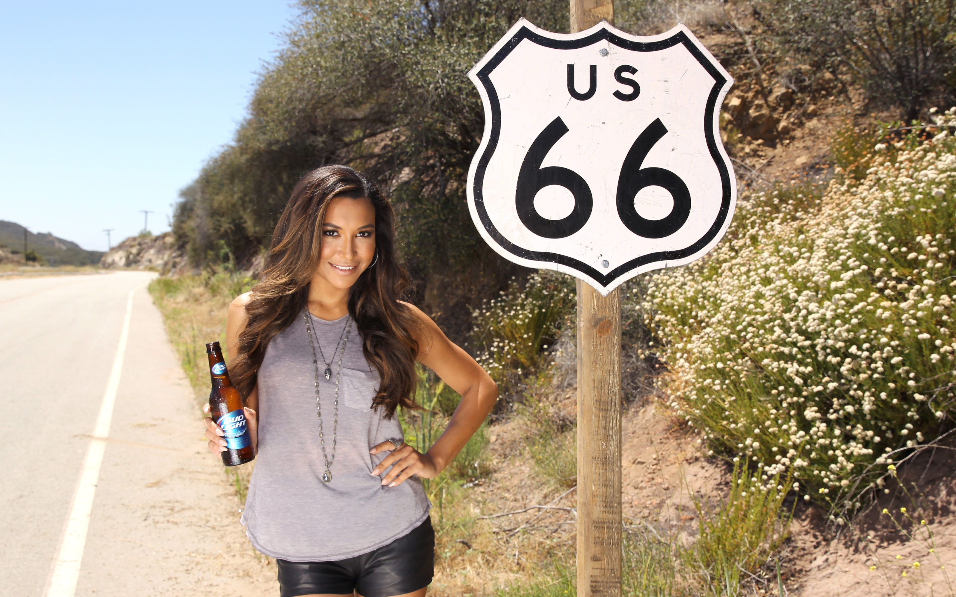 Naya Rivera posing by Route 66 sign with beer HD Wallpaper