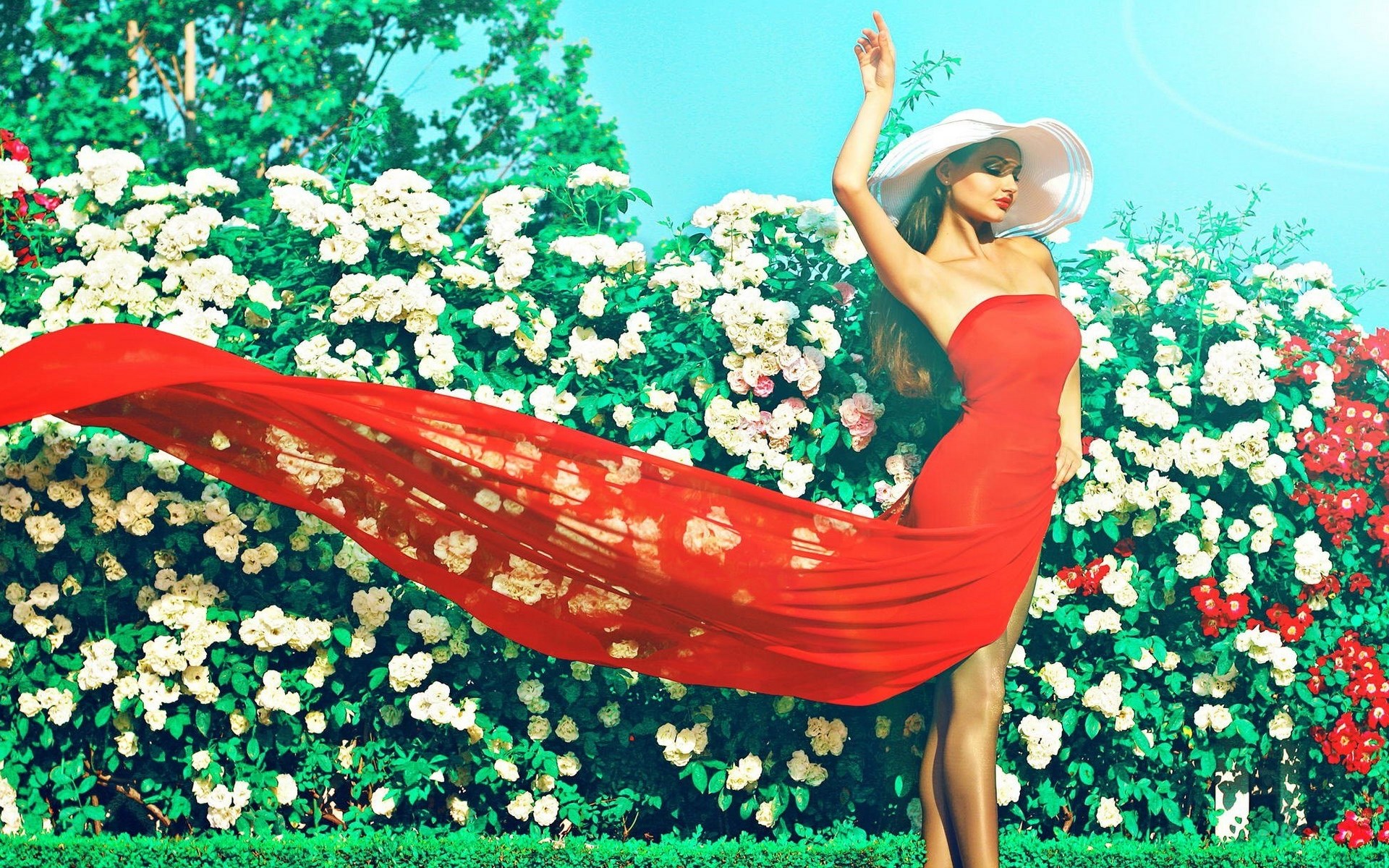 Woman in red dress and hat in garden HD Wallpaper