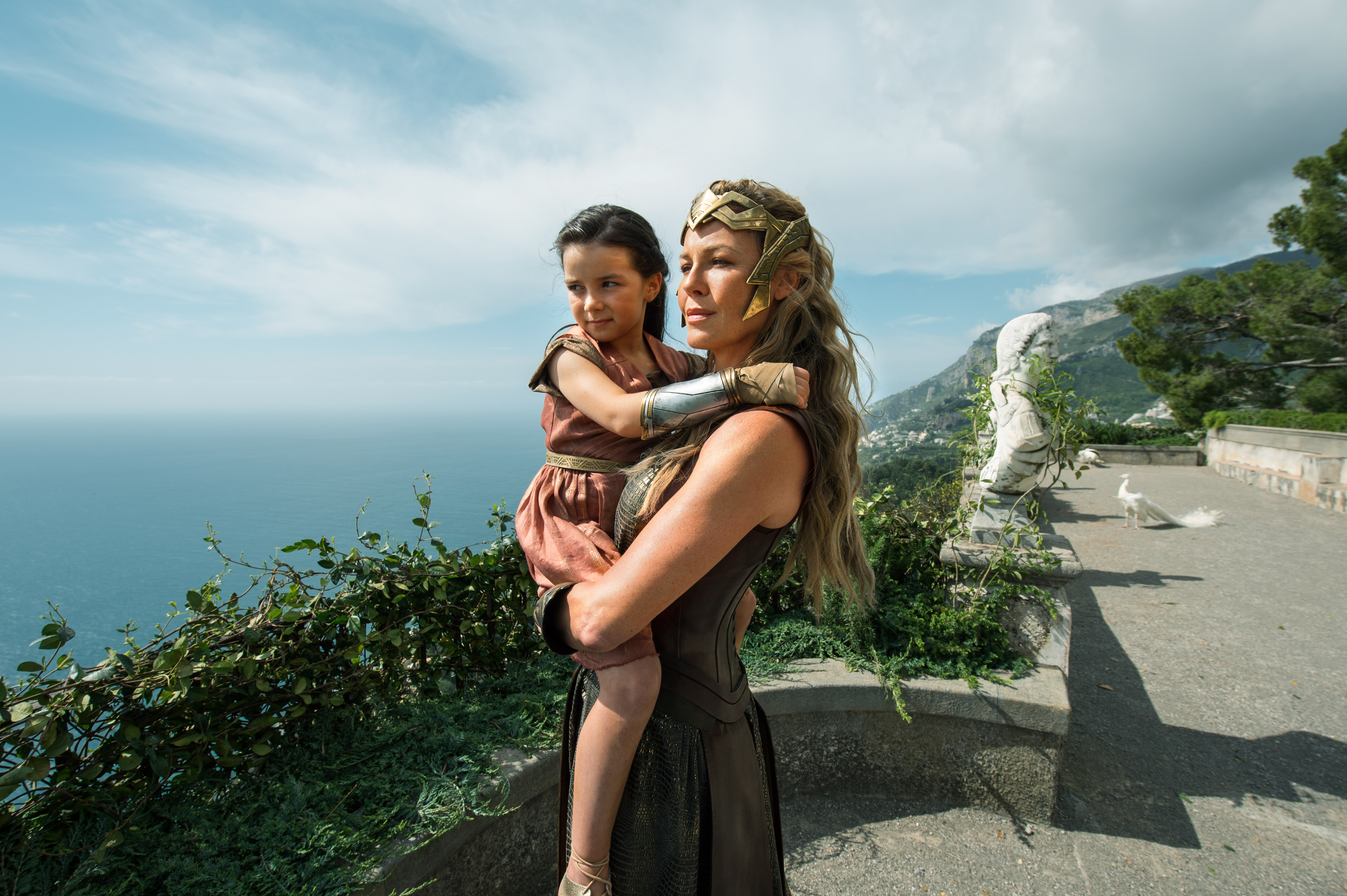 Robin Wright as Antiope holding a young girl HD Wallpaper