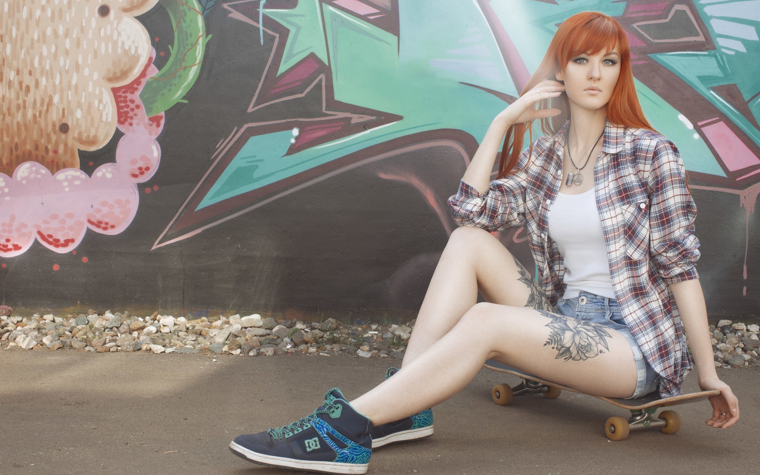Woman with red hair sitting on a skateboard HD Wallpaper