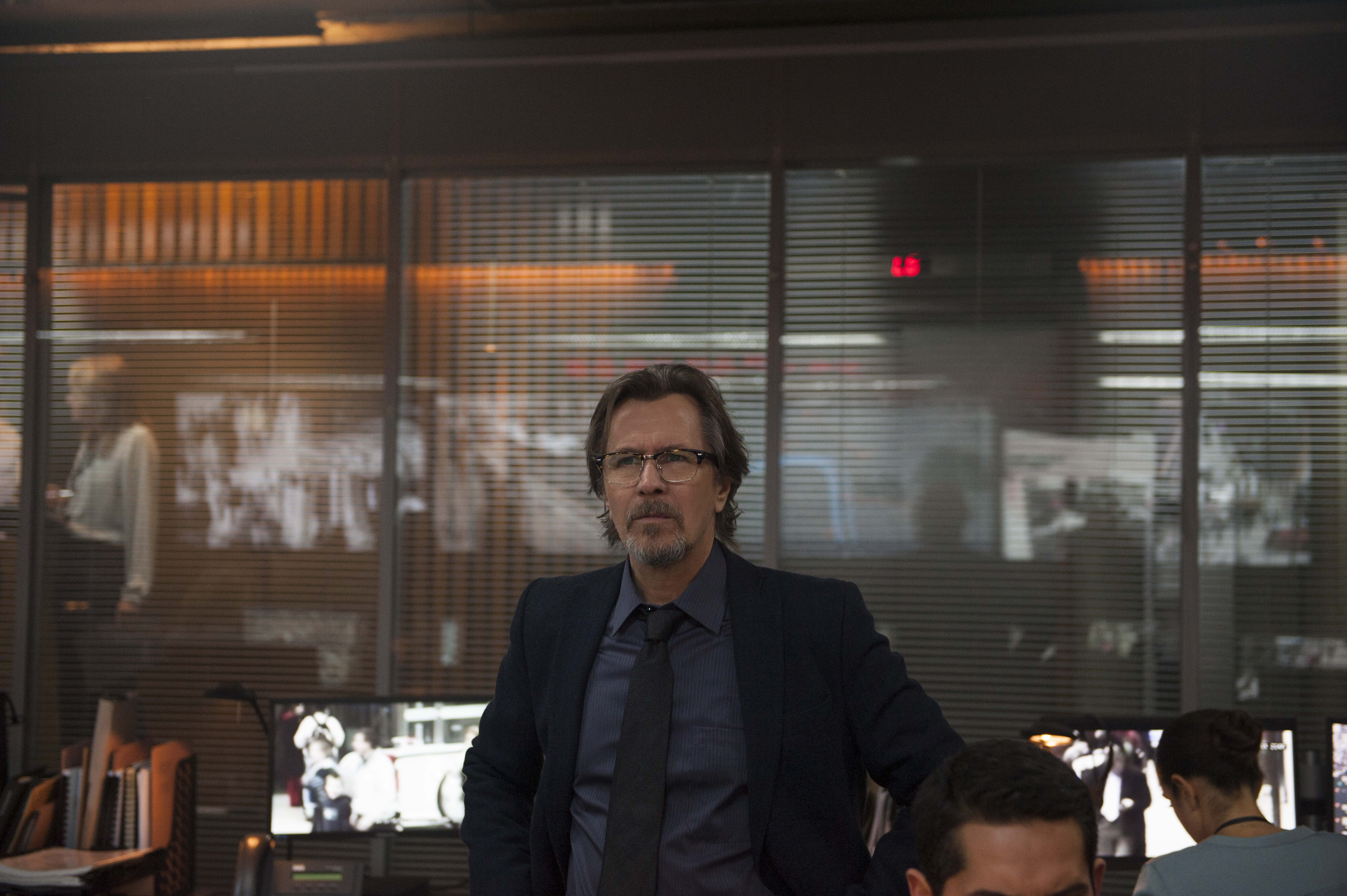Gary Oldman in an office setting HD Wallpaper