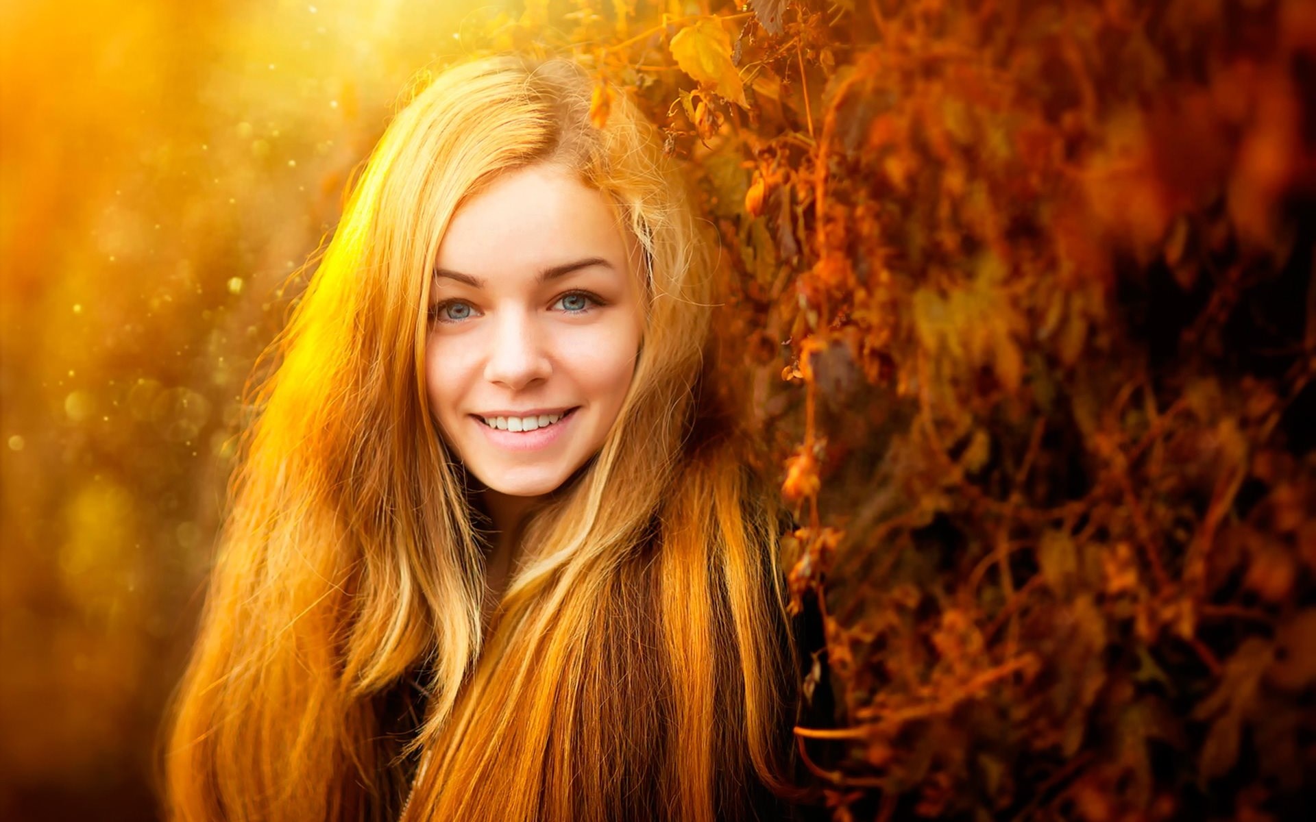Young woman with blonde hair smiling HD Wallpaper