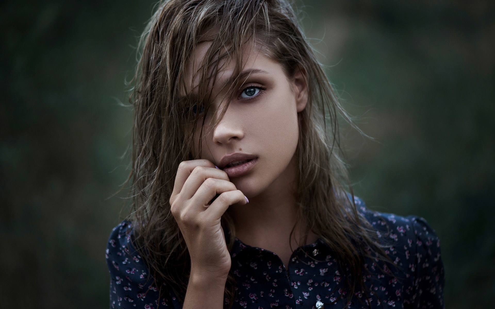 Woman with wet hair touching her face HD Wallpaper