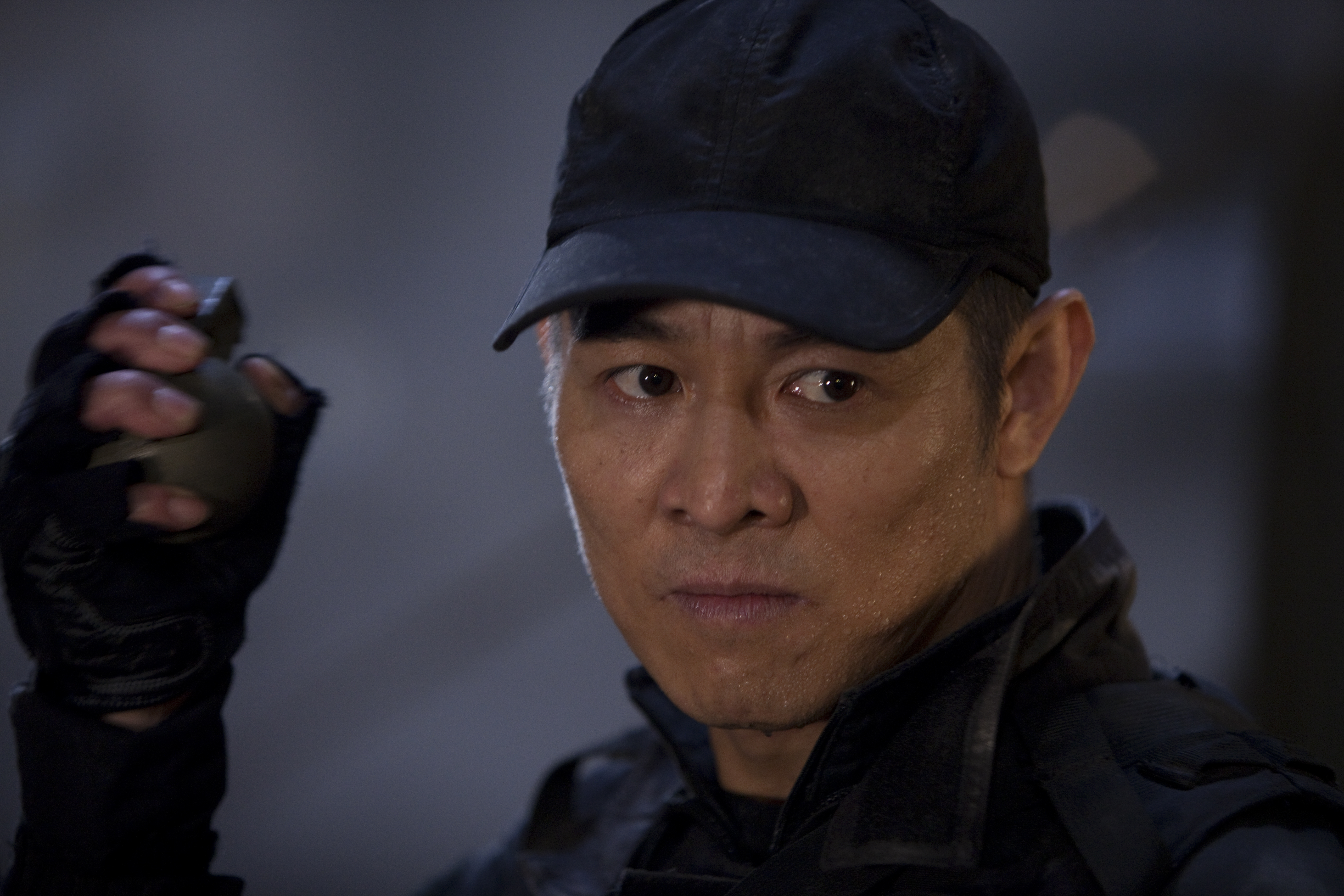 Jet Li holding a grenade HD Wallpaper