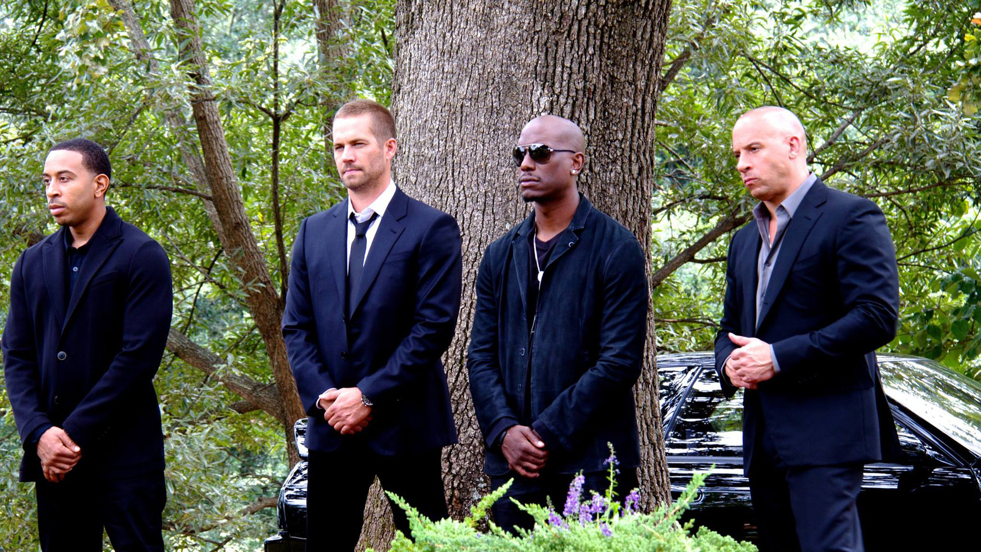 Four men in suits standing outdoors HD Wallpaper