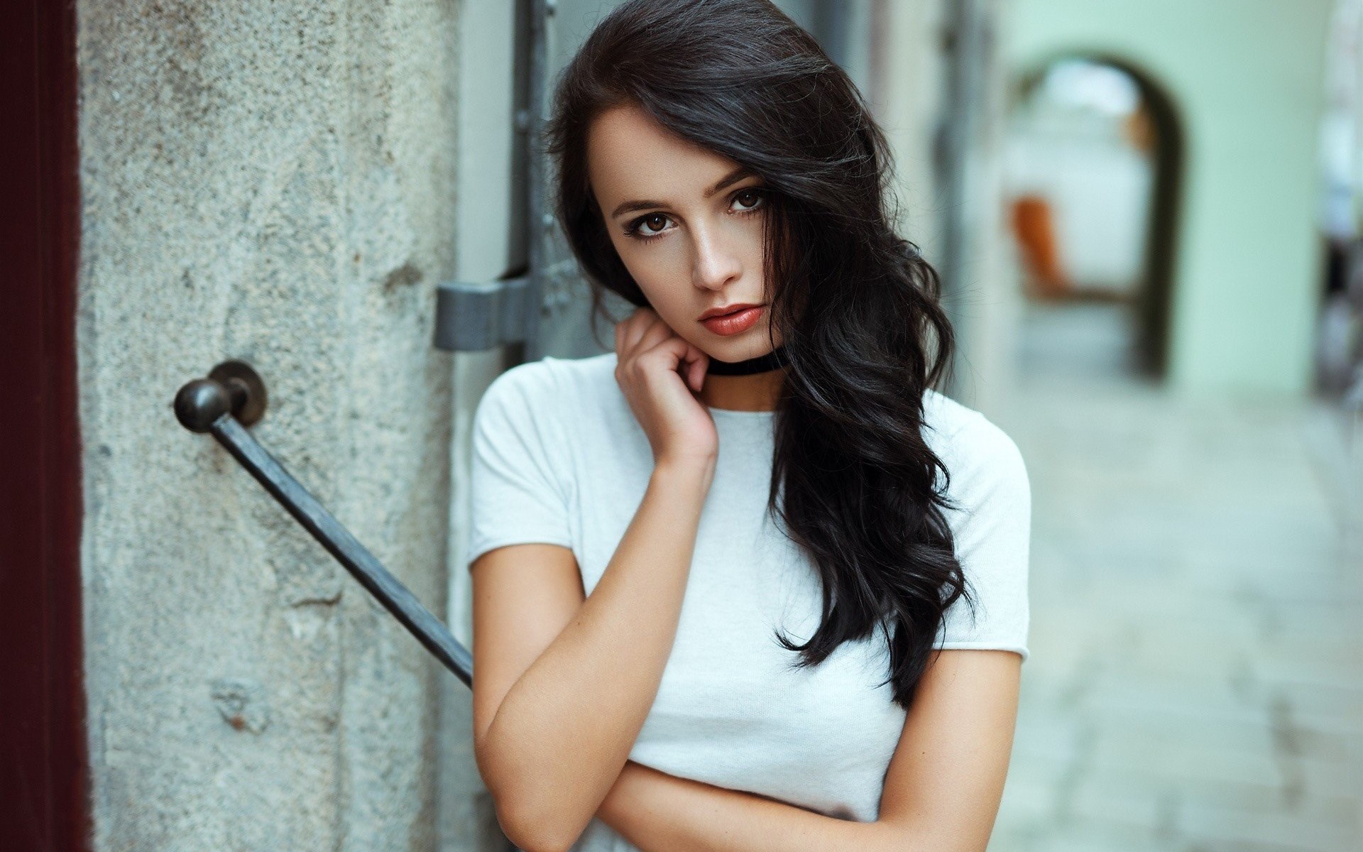 Woman with dark hair wearing a white t-shirt HD Wallpaper