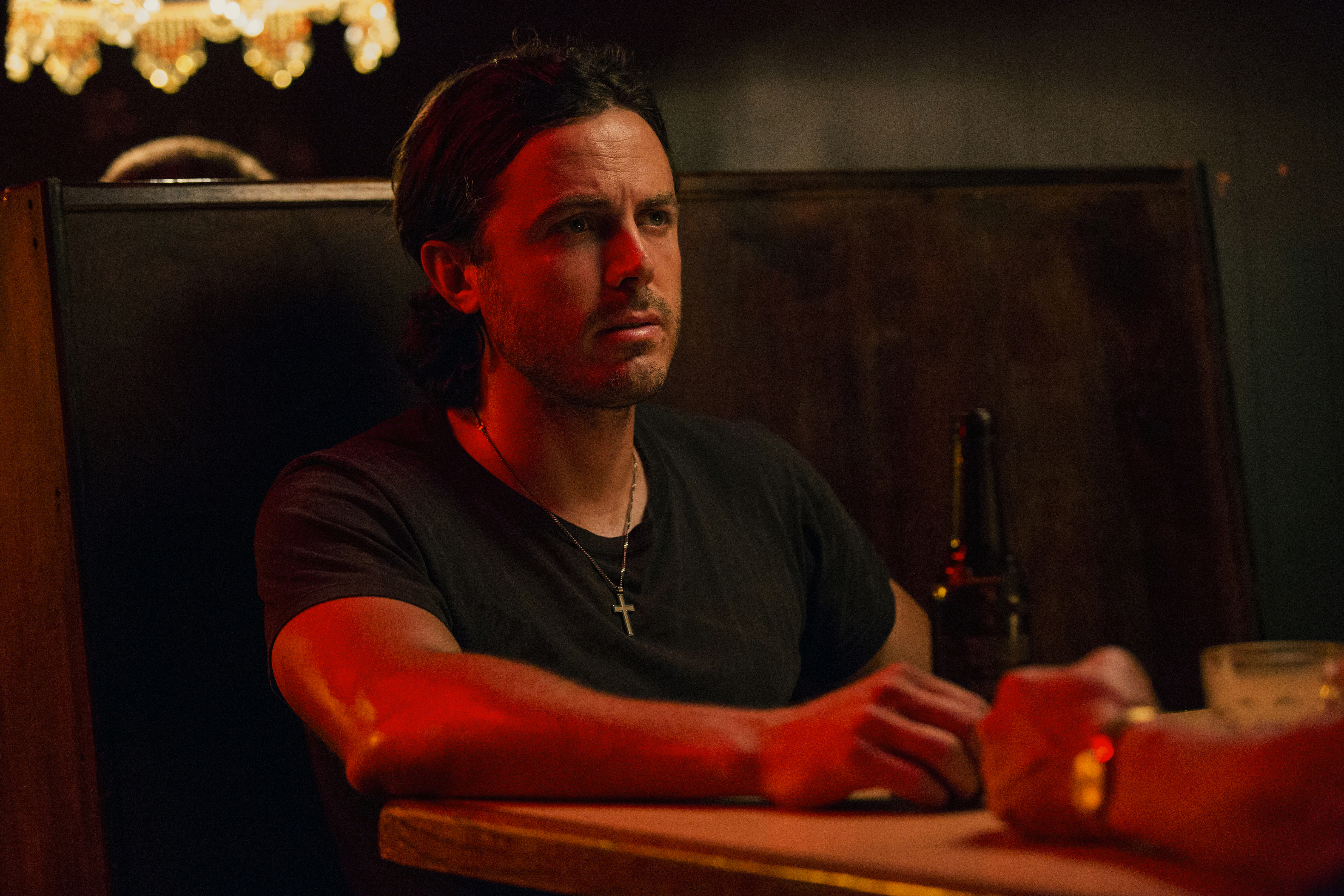 Casey Affleck in a booth HD Wallpaper