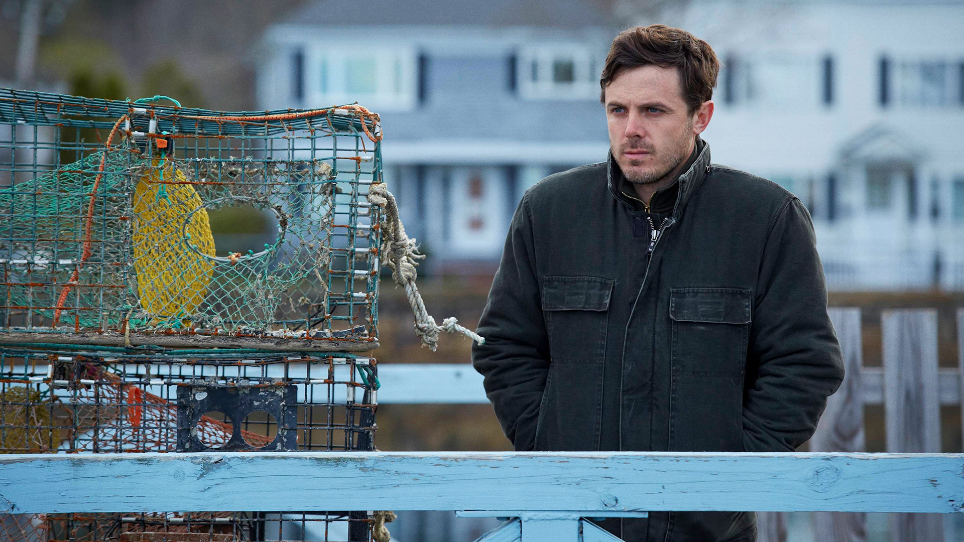Casey Affleck standing by lobster traps HD Wallpaper