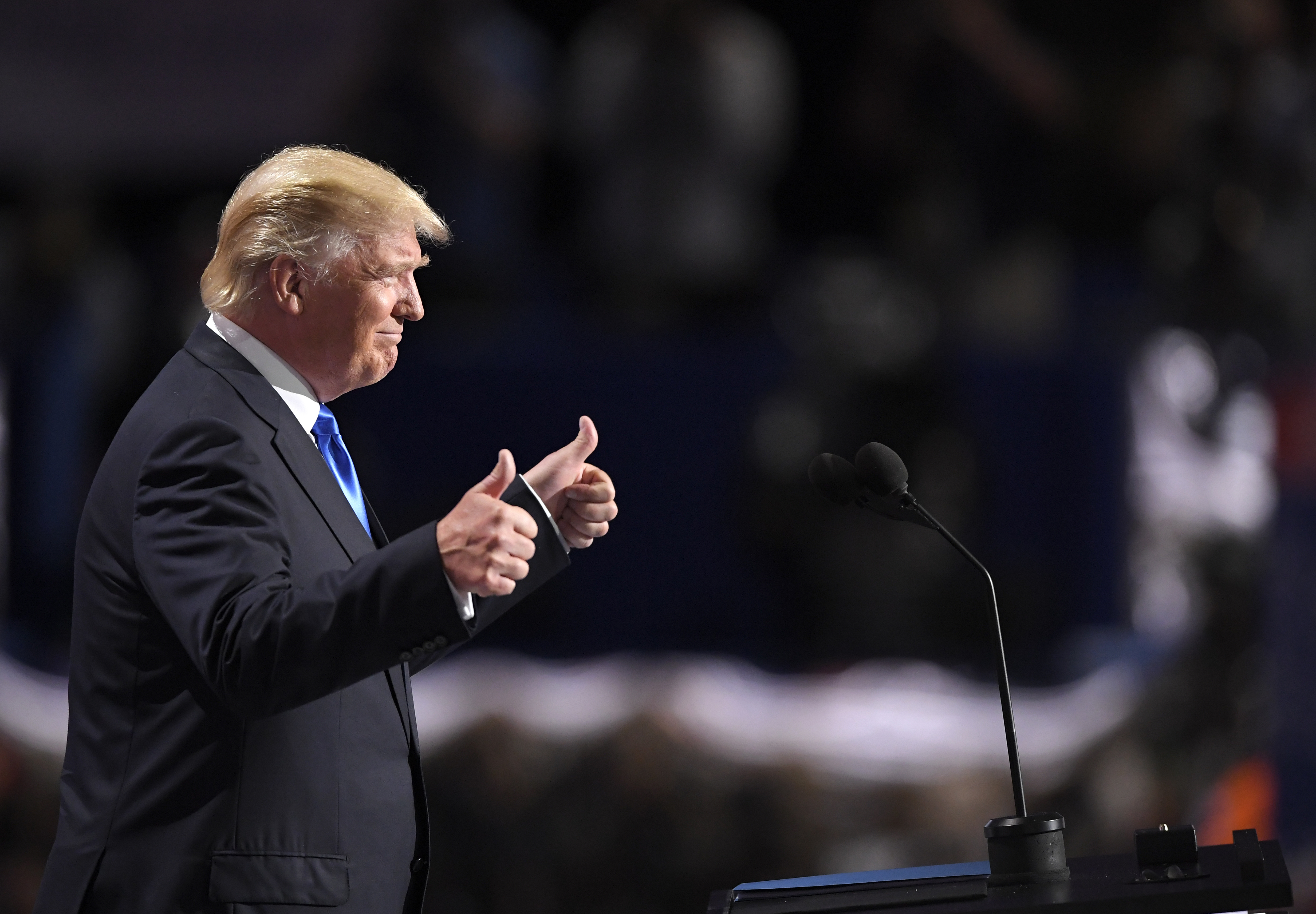 Donald Trump giving thumbs up at podium HD Wallpaper