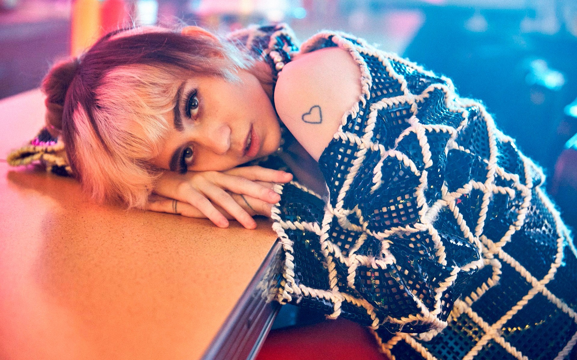 Woman with pink hair resting head on table HD Wallpaper