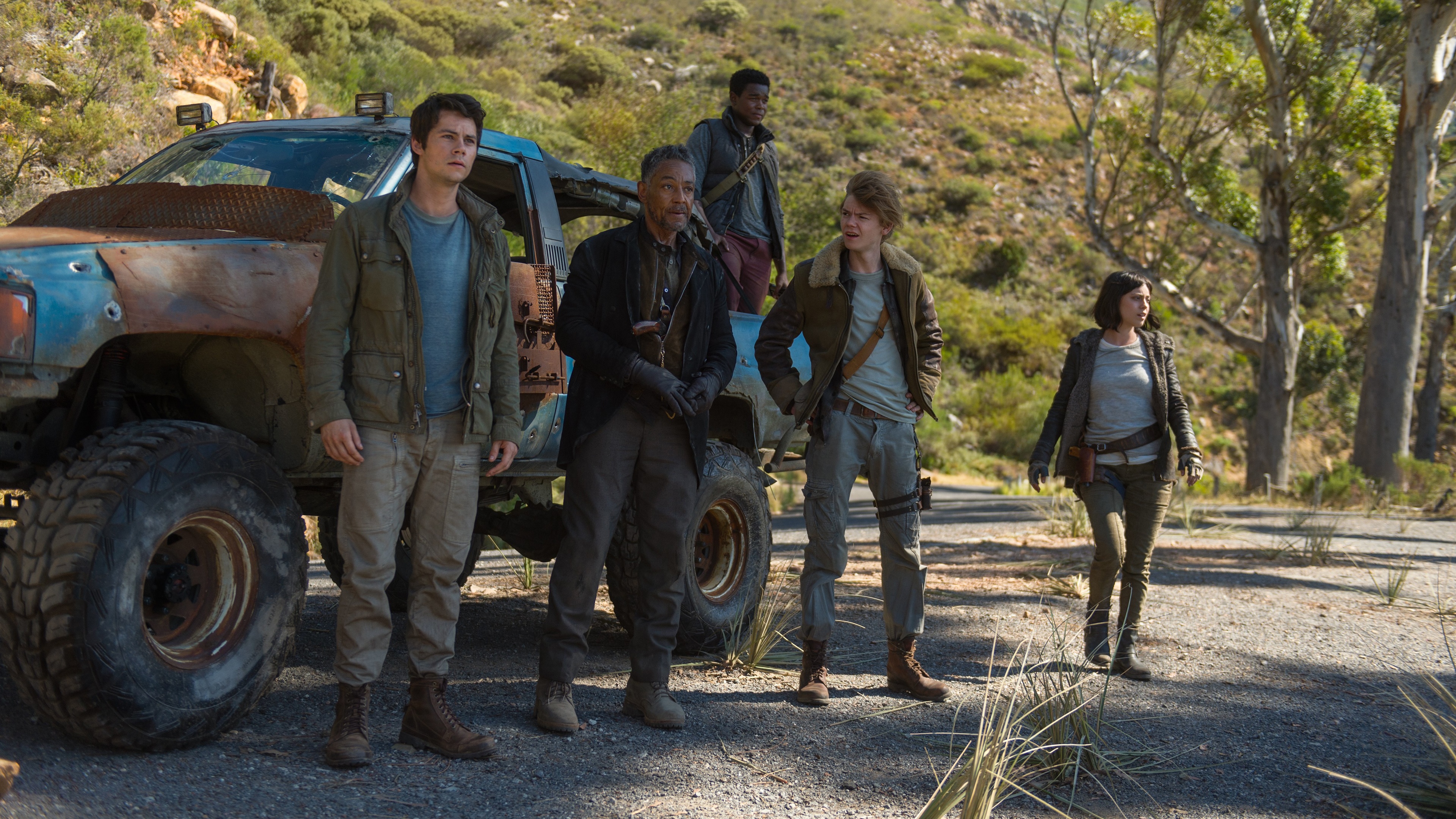 Dylan O'Brien and group with vehicle HD Wallpaper
