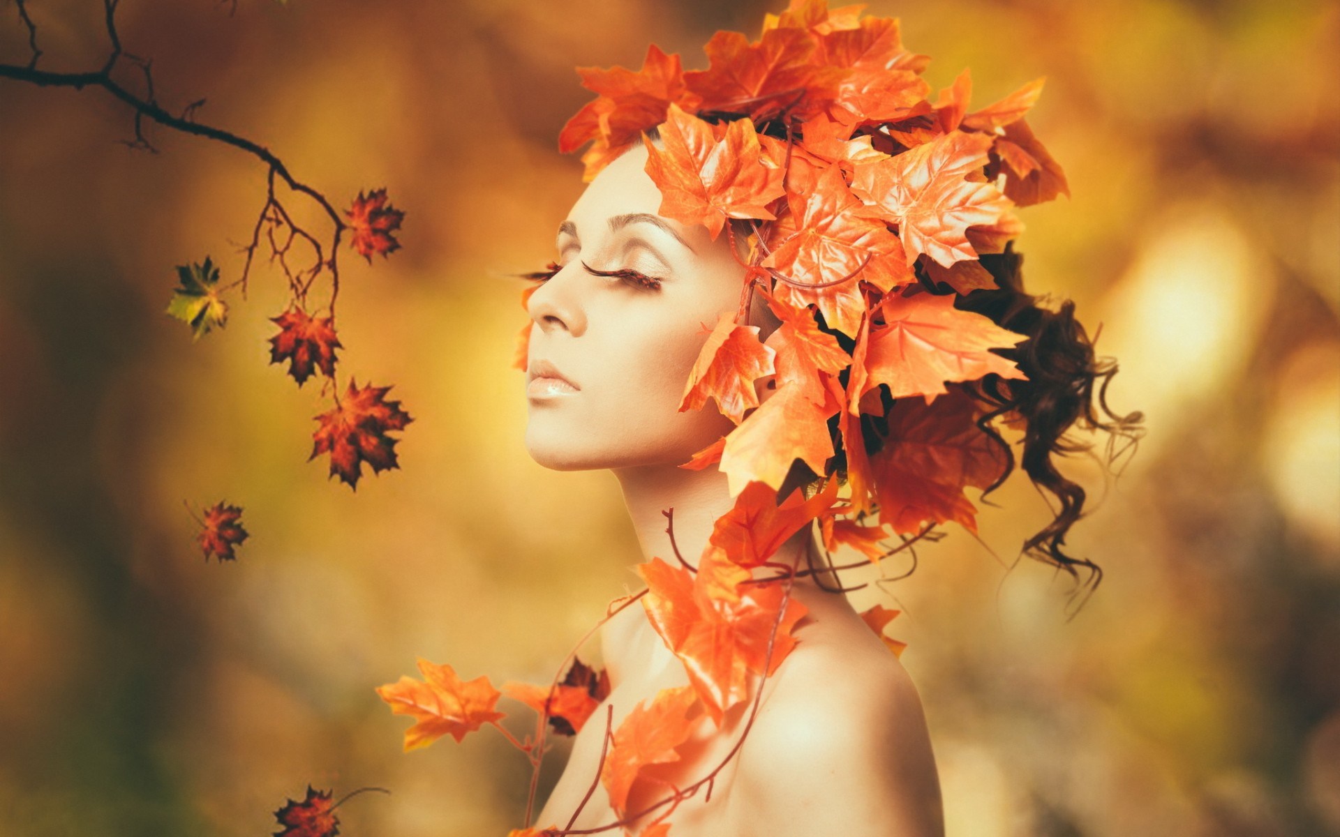 Woman with autumn leaves in her hair HD Wallpaper