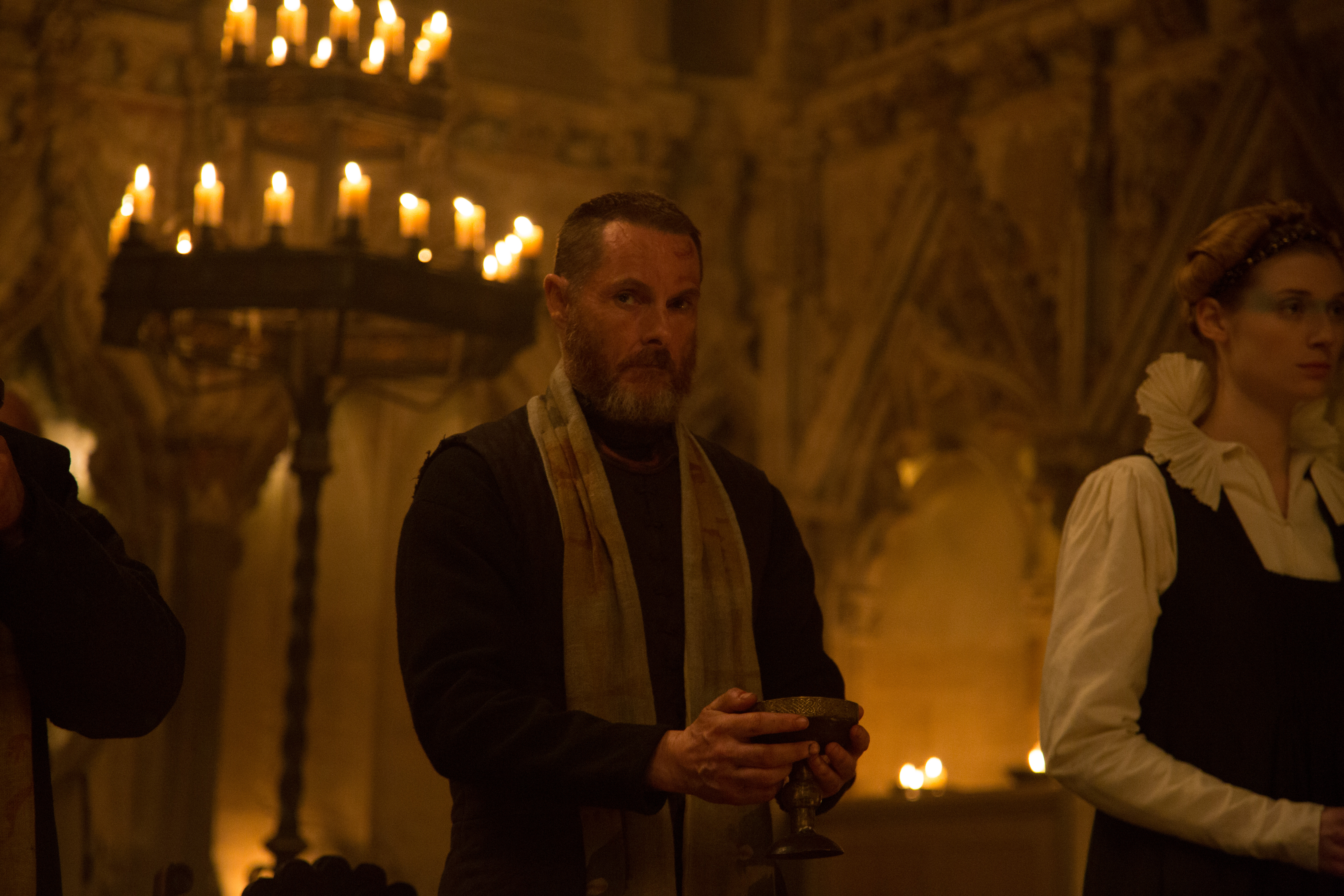 Man holding chalice in church HD Wallpaper