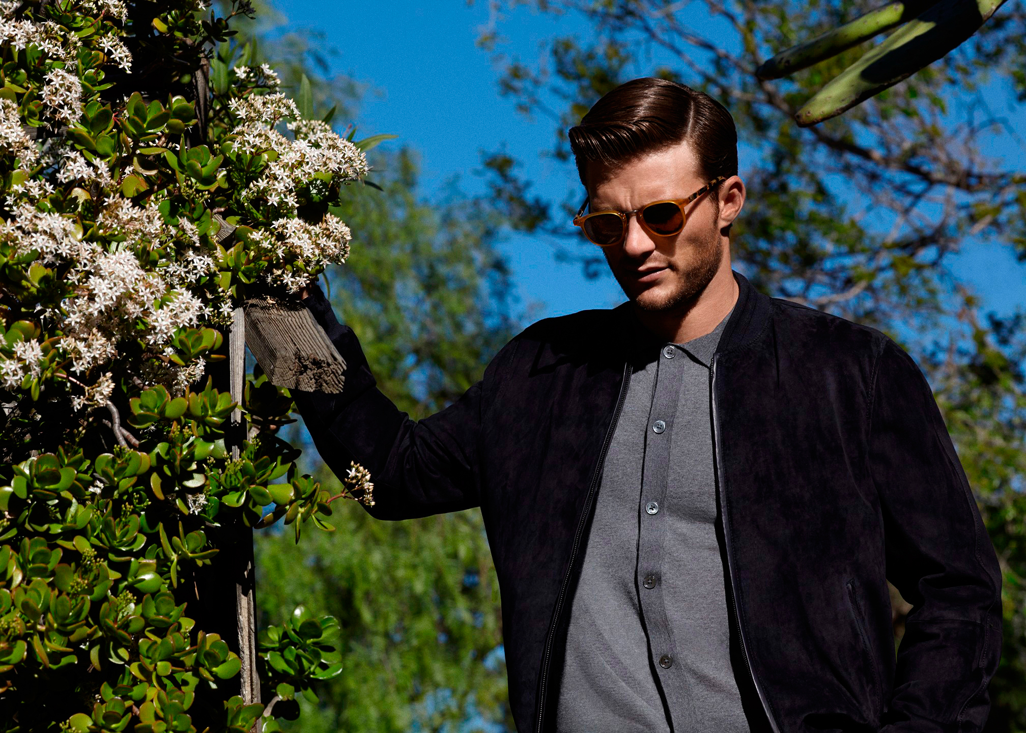 Scott Eastwood in a garden HD Wallpaper