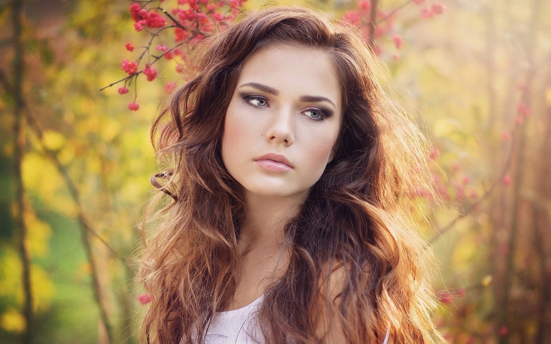 Woman with long brown hair and makeup HD Wallpaper
