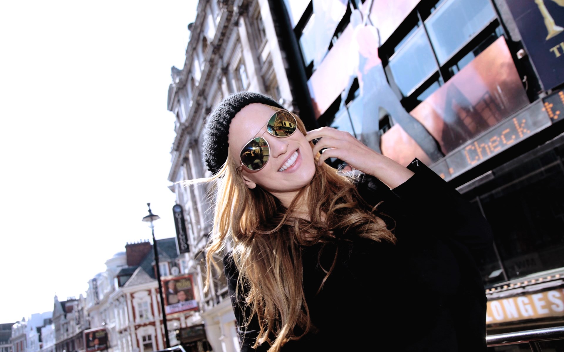 Woman in sunglasses and beanie in London HD Wallpaper