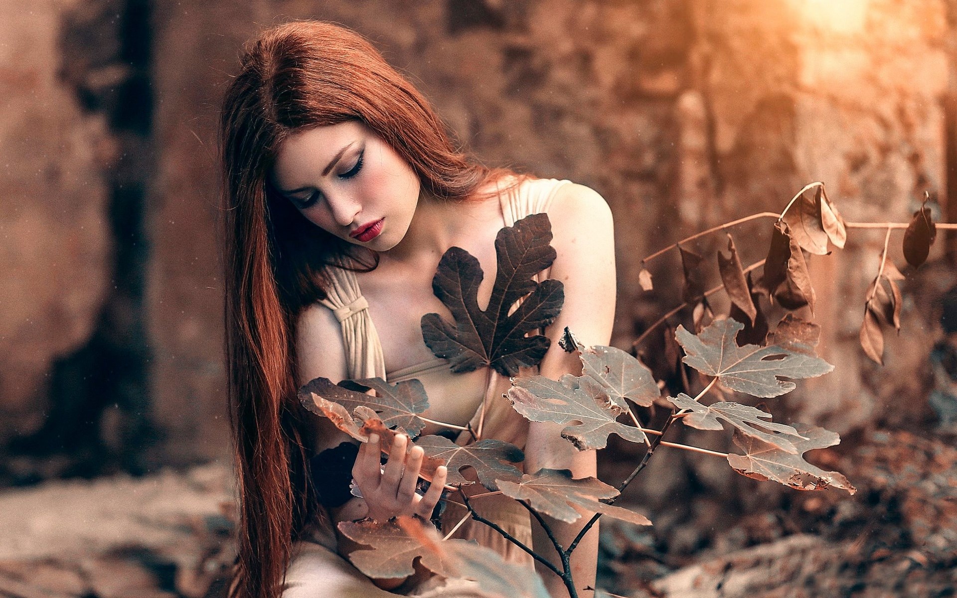 Woman with long red hair holding leaves HD Wallpaper