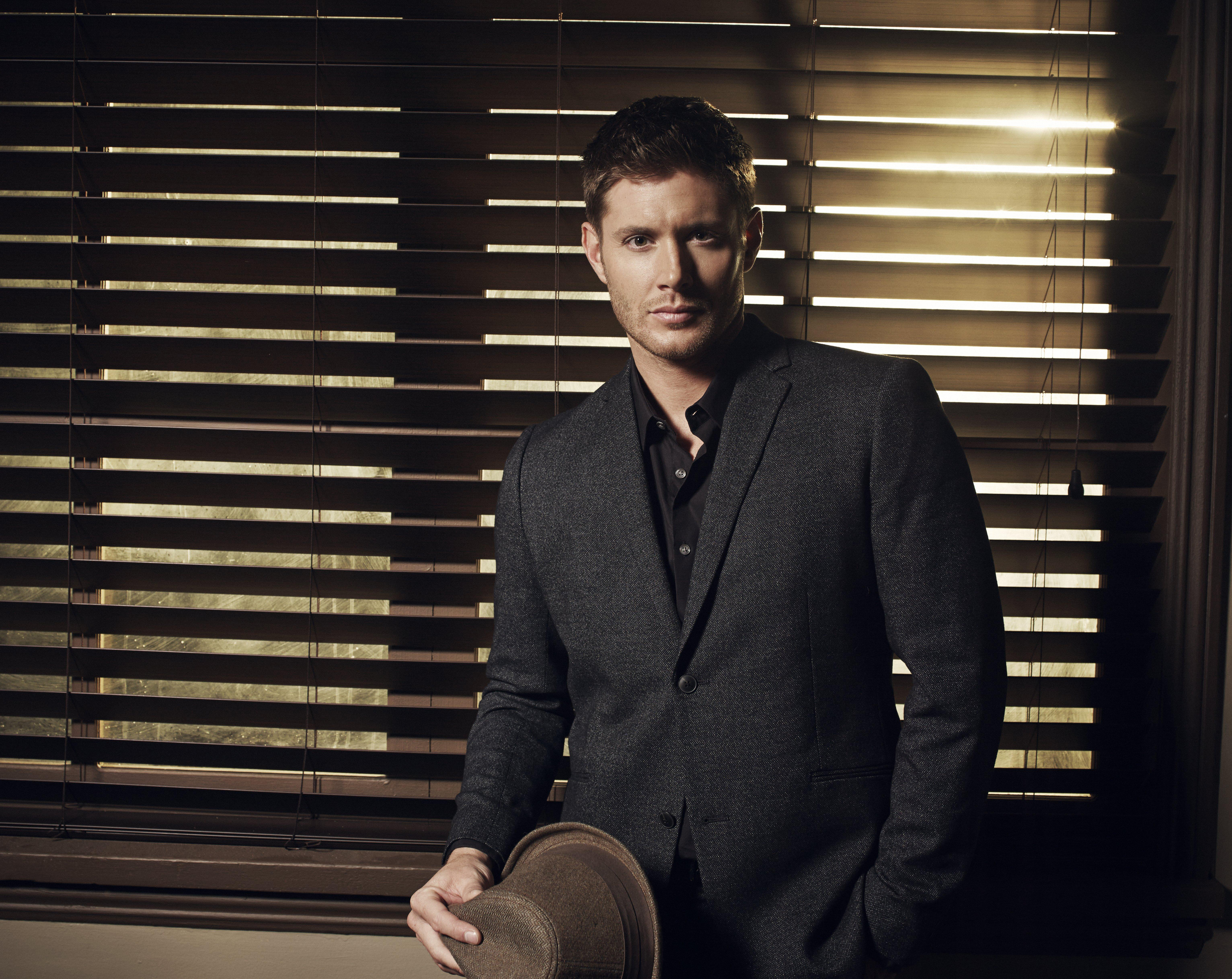 Jensen Ackles in a Suit Holding a Hat HD Wallpaper