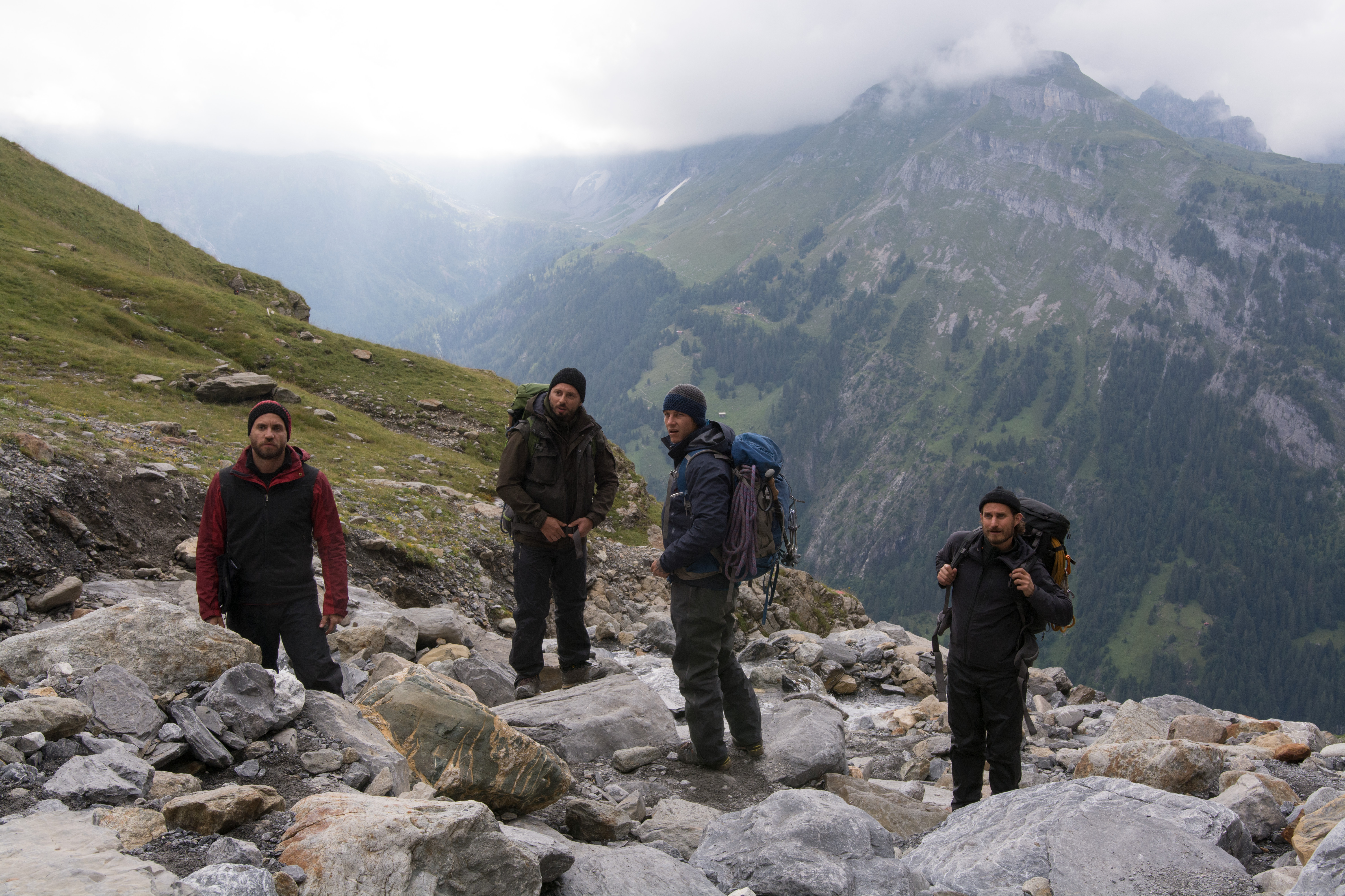 Edgar Ramírez and three men hiking in mountains HD Wallpaper