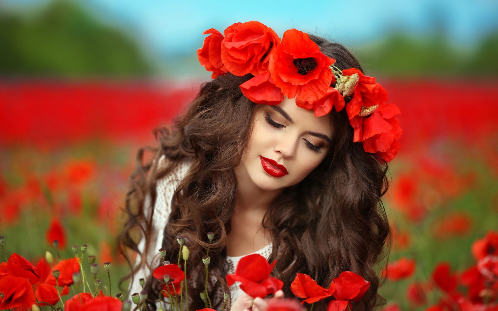 Woman with poppy flower crown in poppy field HD Wallpaper