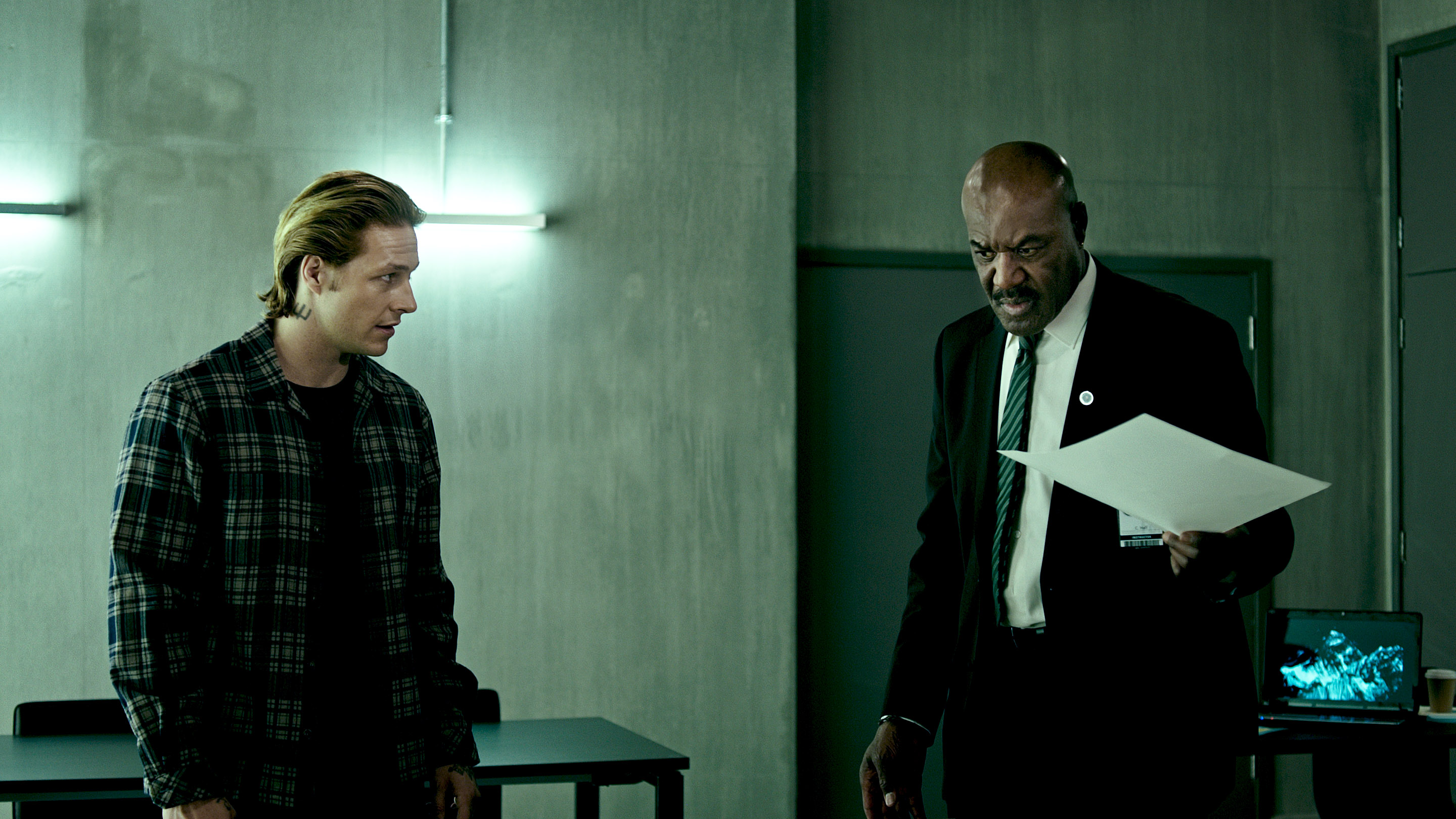 Luke Bracey and man in suit with papers HD Wallpaper