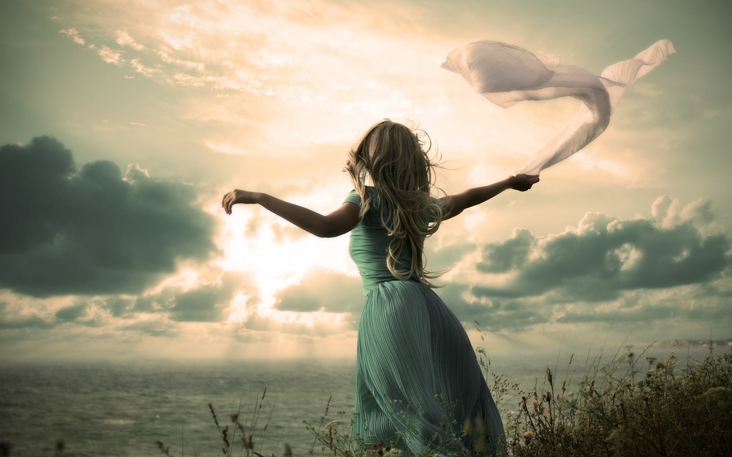 Woman with flowing scarf on a cliff by the sea HD Wallpaper
