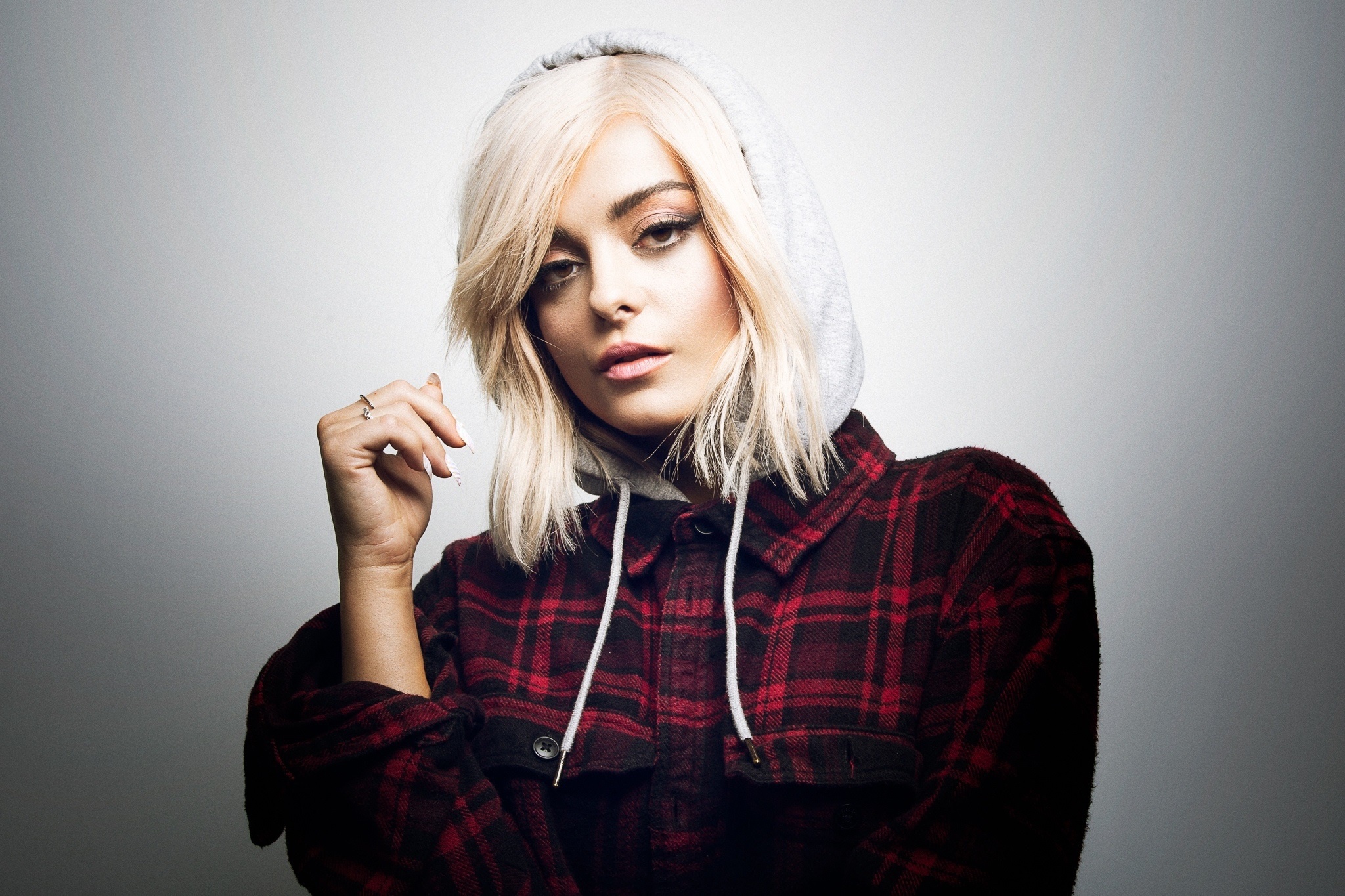 Bebe Rexha wearing a plaid shirt and hoodie HD Wallpaper