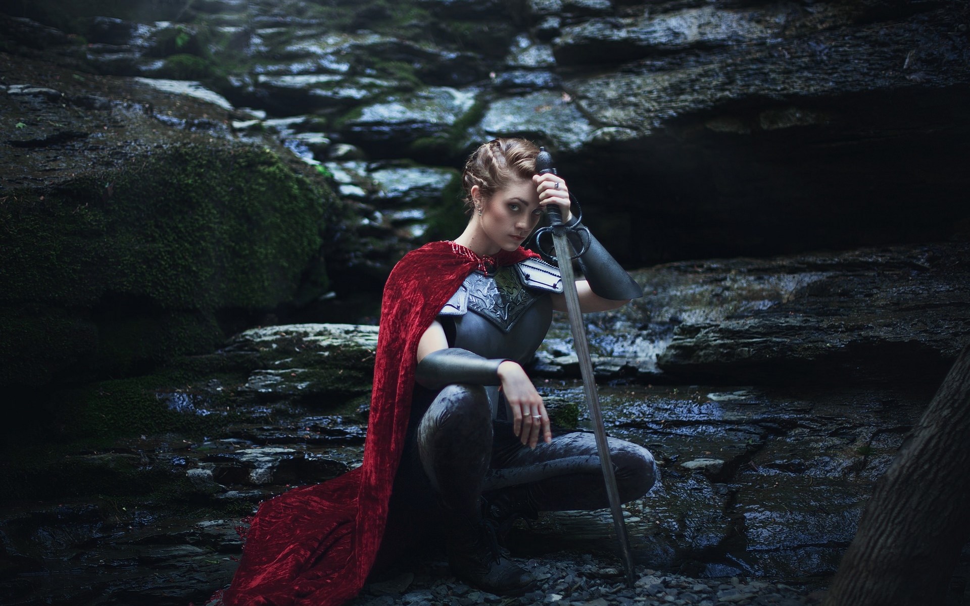Woman in armor with sword in forest HD Wallpaper