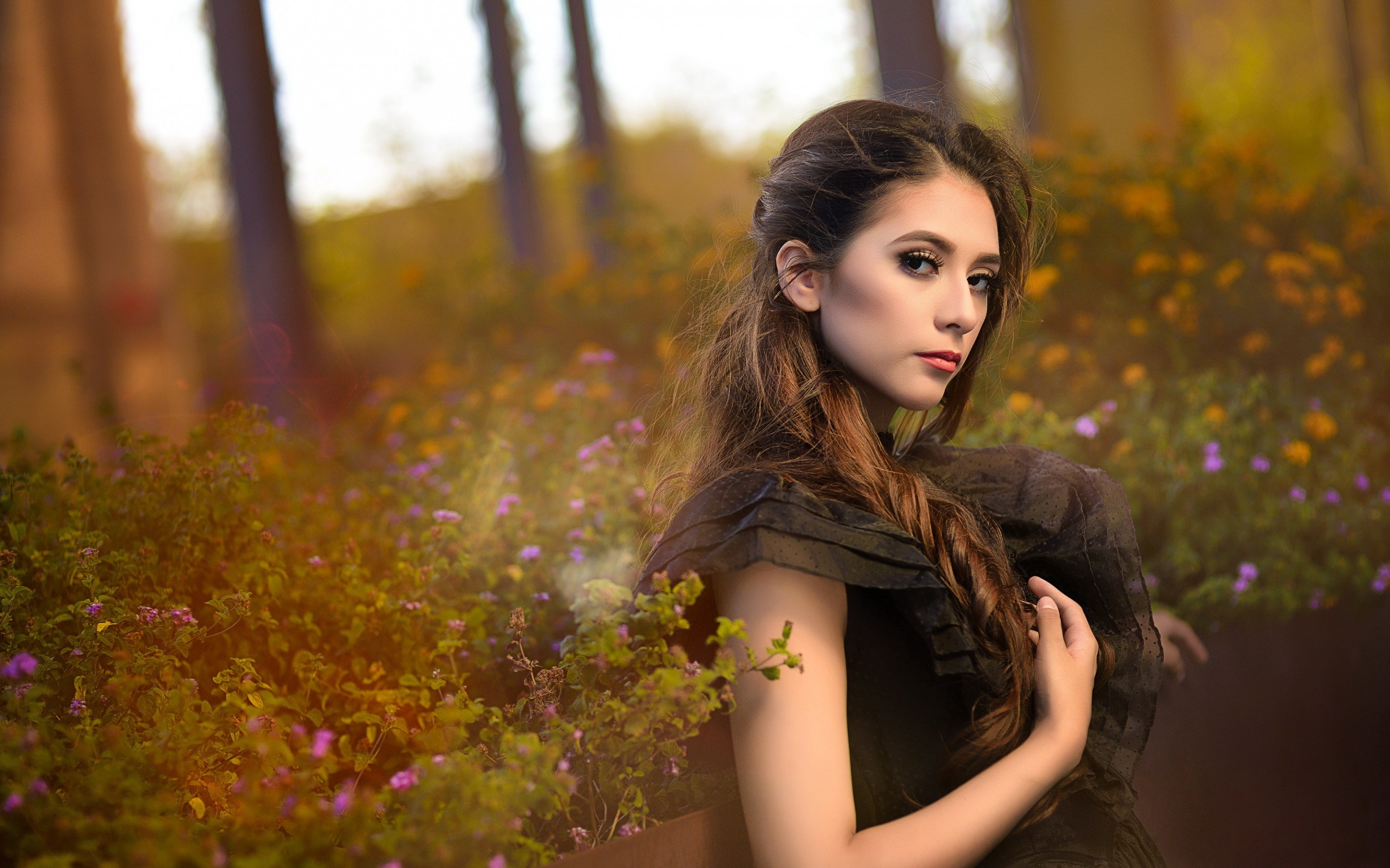 Woman in black dress in a garden HD Wallpaper