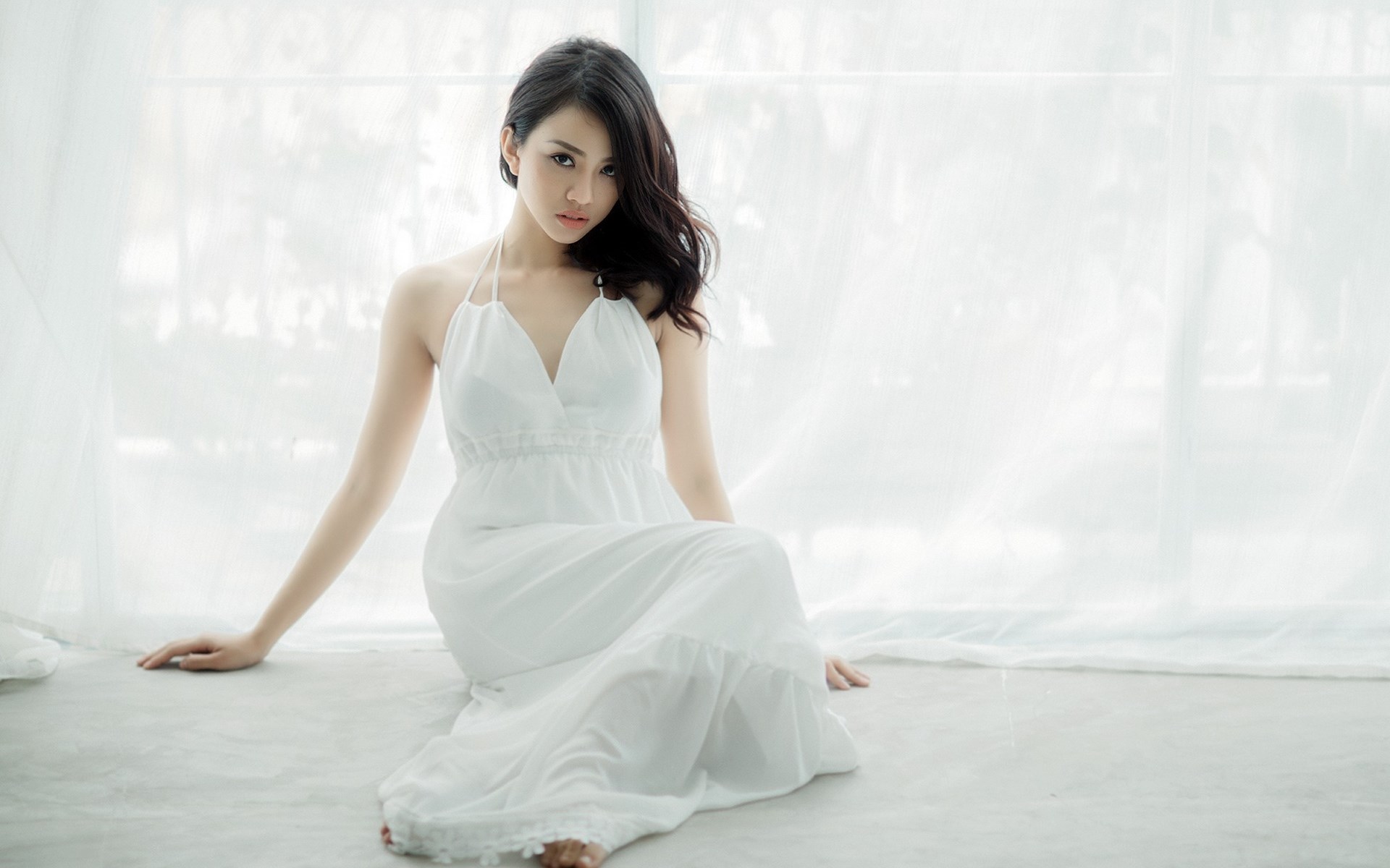 Woman in white dress sitting by window HD Wallpaper