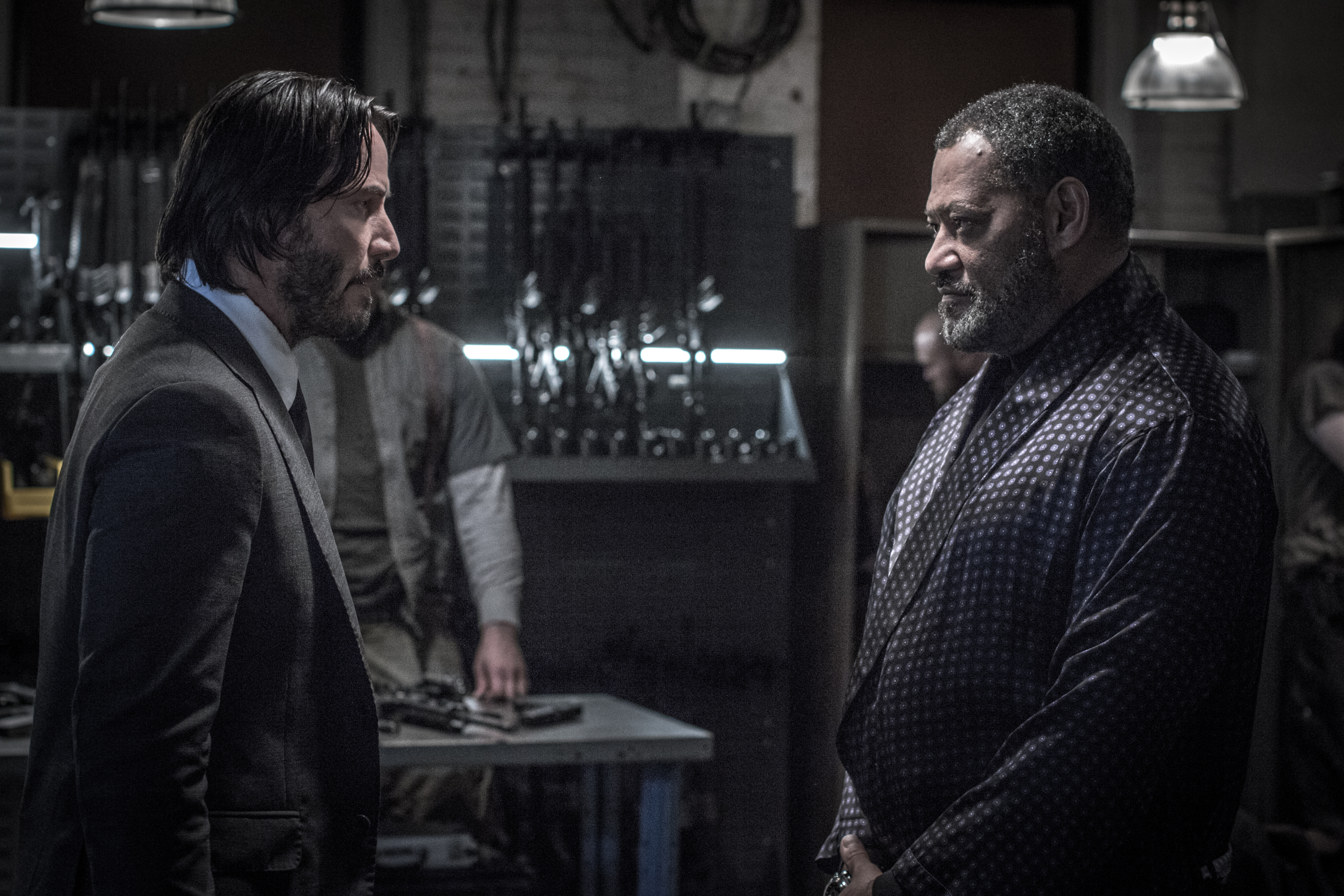 John Wick and Laurence Fishburne in a gun room HD Wallpaper