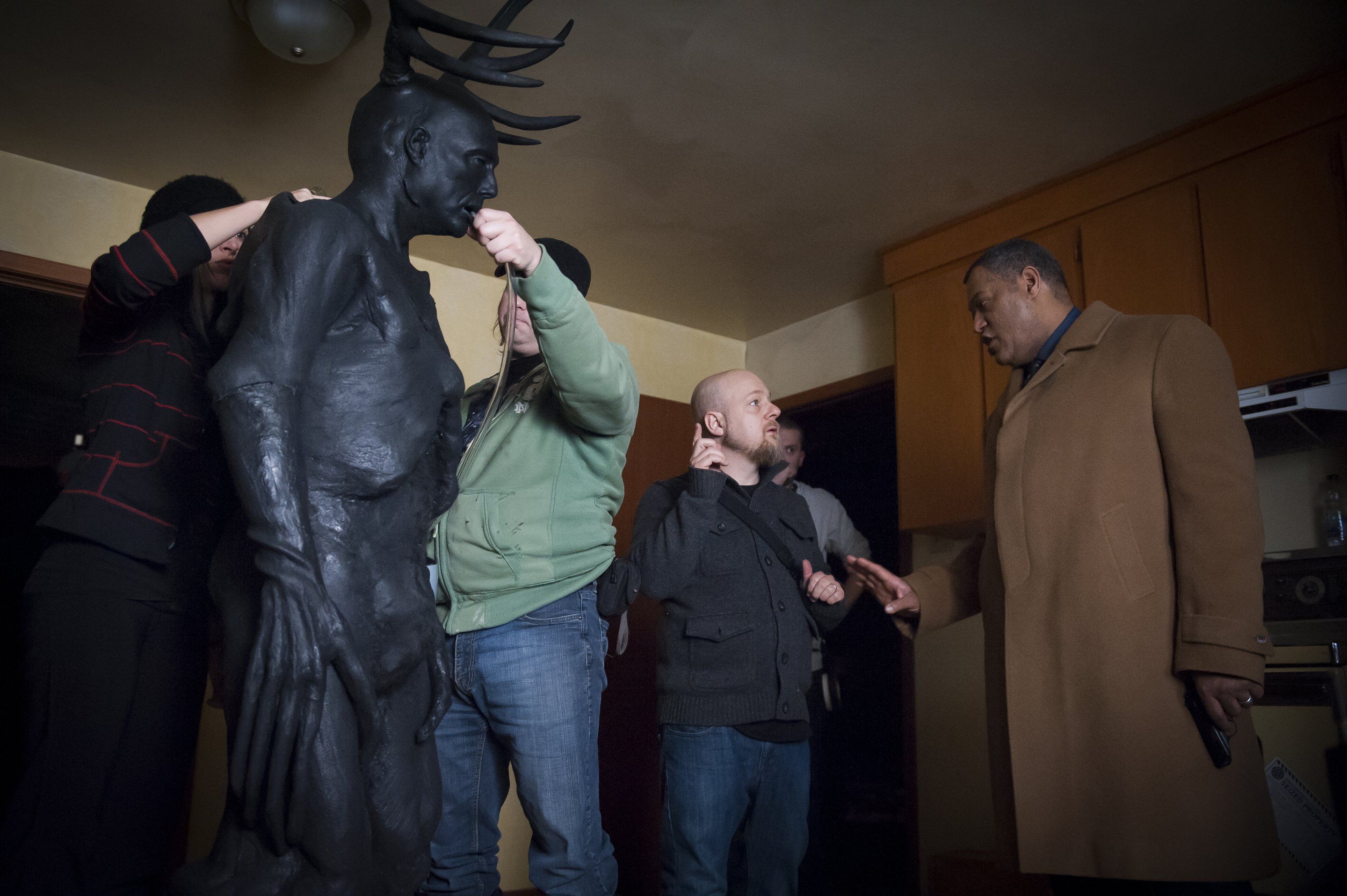 Laurence Fishburne with a statue HD Wallpaper