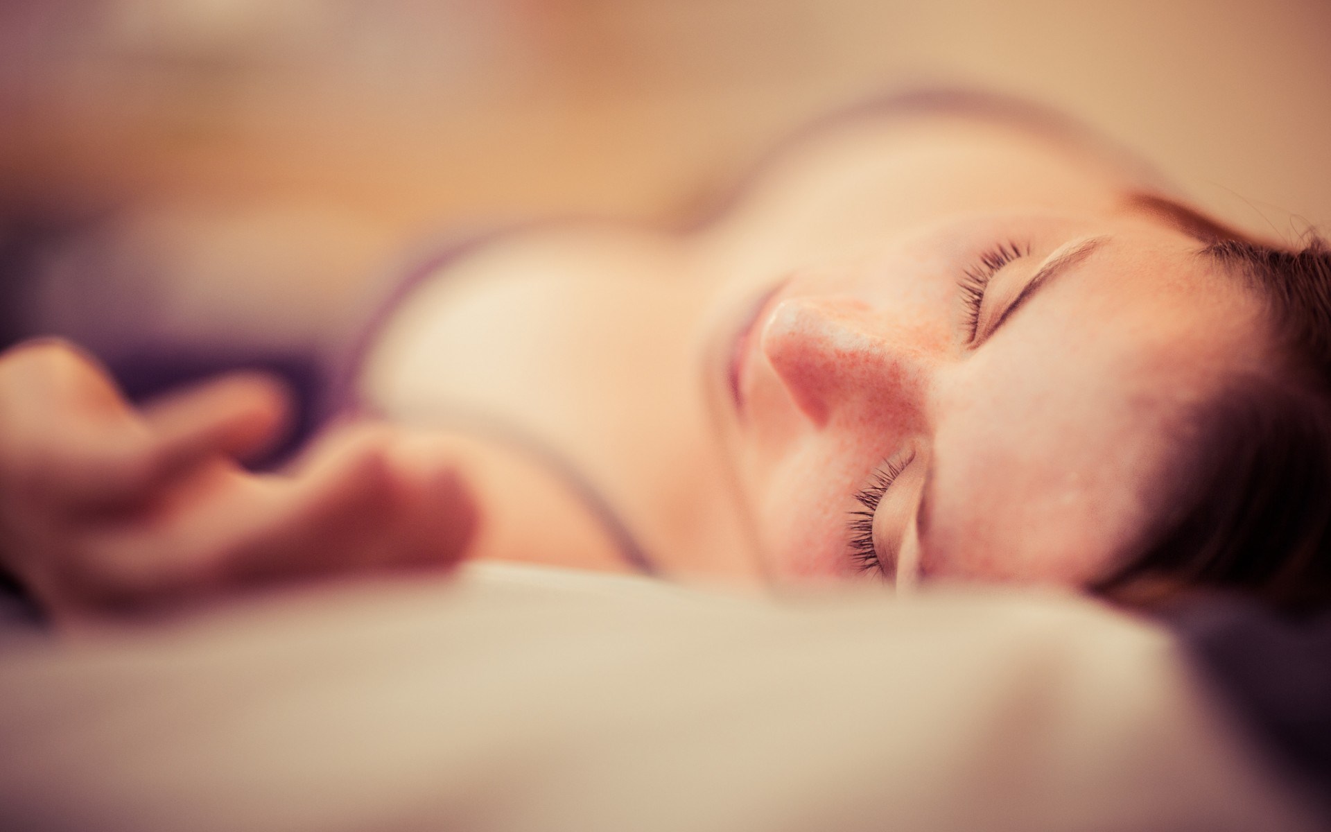 Woman sleeping on a bed HD Wallpaper