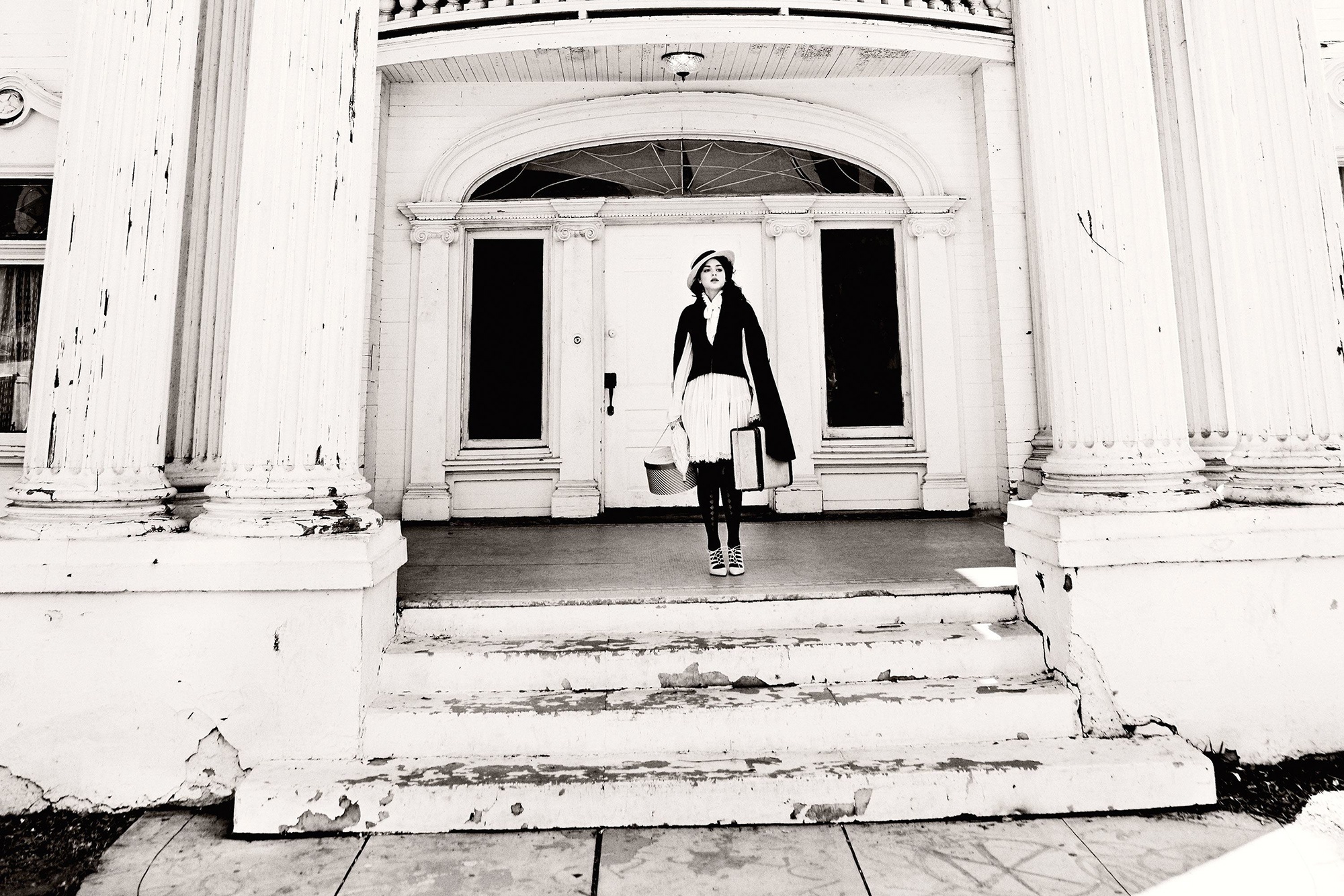 Odeya Rush standing on steps of old building HD Wallpaper