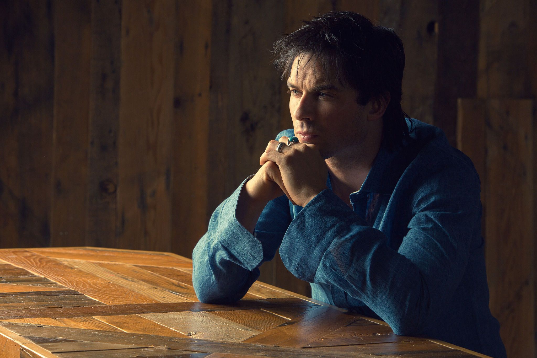 Ian Somerhalder sitting at a wooden table HD Wallpaper