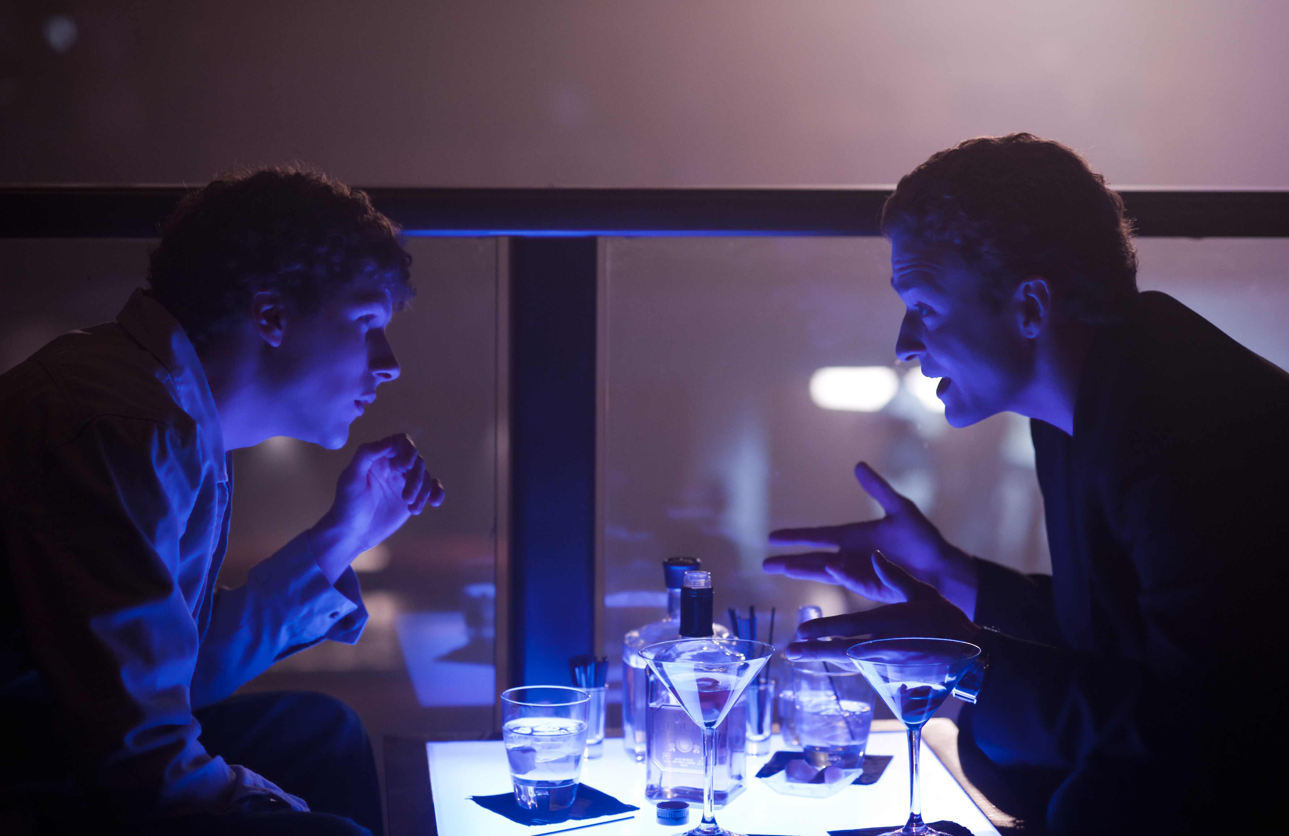 Two men talking at a table with drinks HD Wallpaper