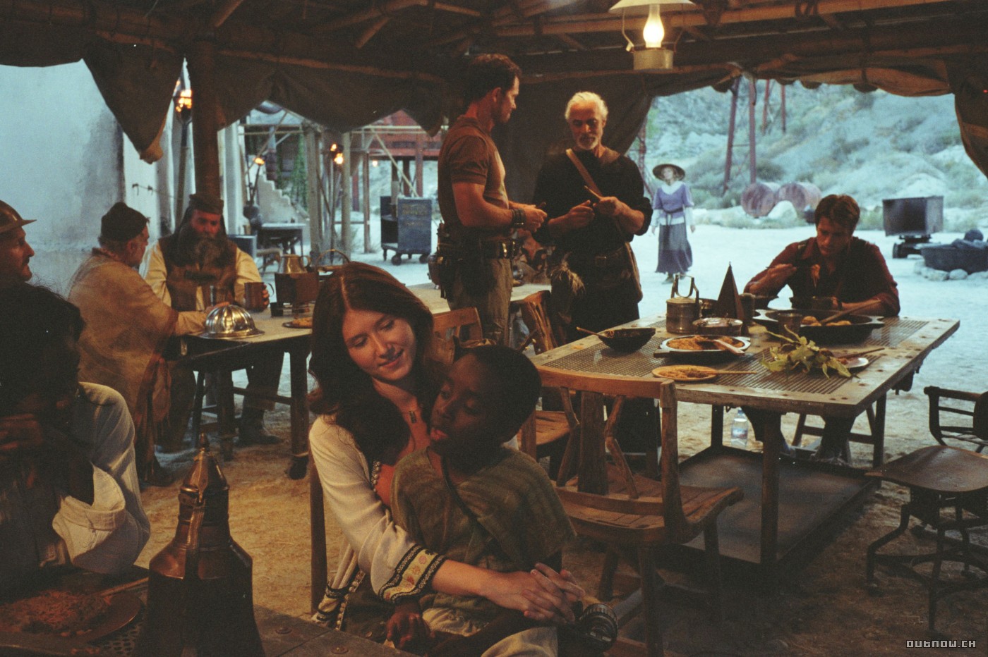 Jewel Staite with a child in a desert encampment HD Wallpaper