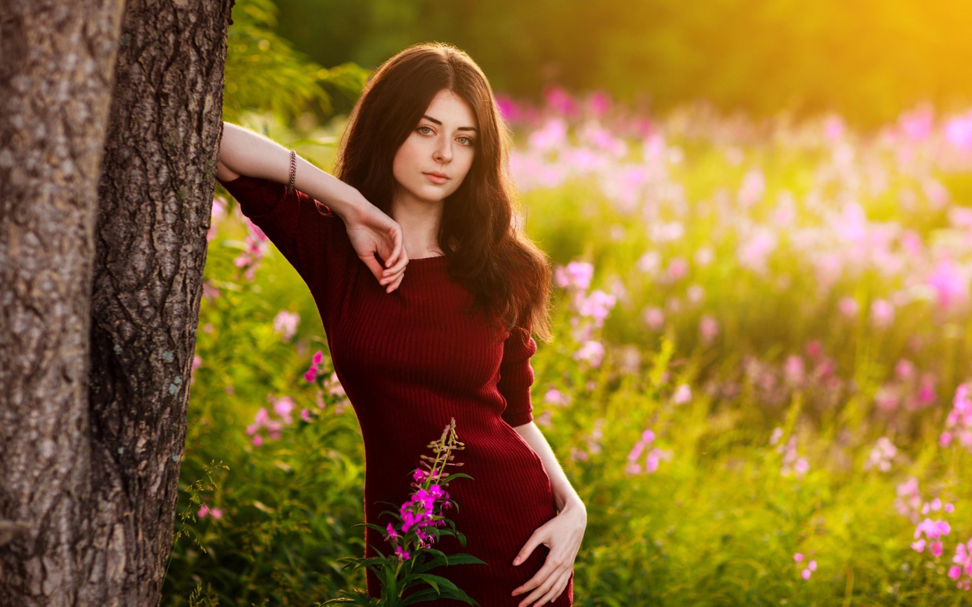 Young woman in a red dress in a field of flowers HD Wallpaper