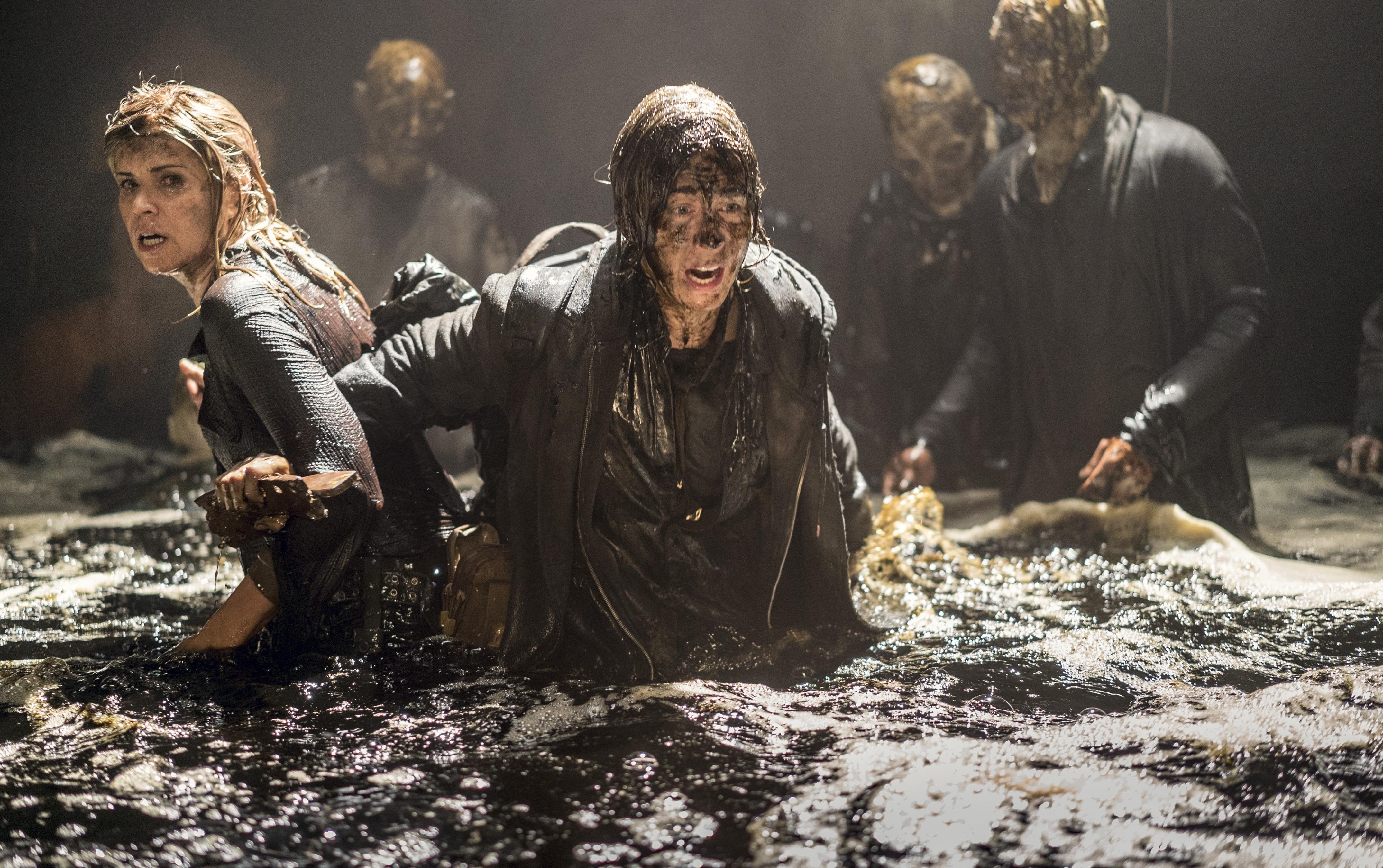 Kim Dickens in murky water with zombies HD Wallpaper