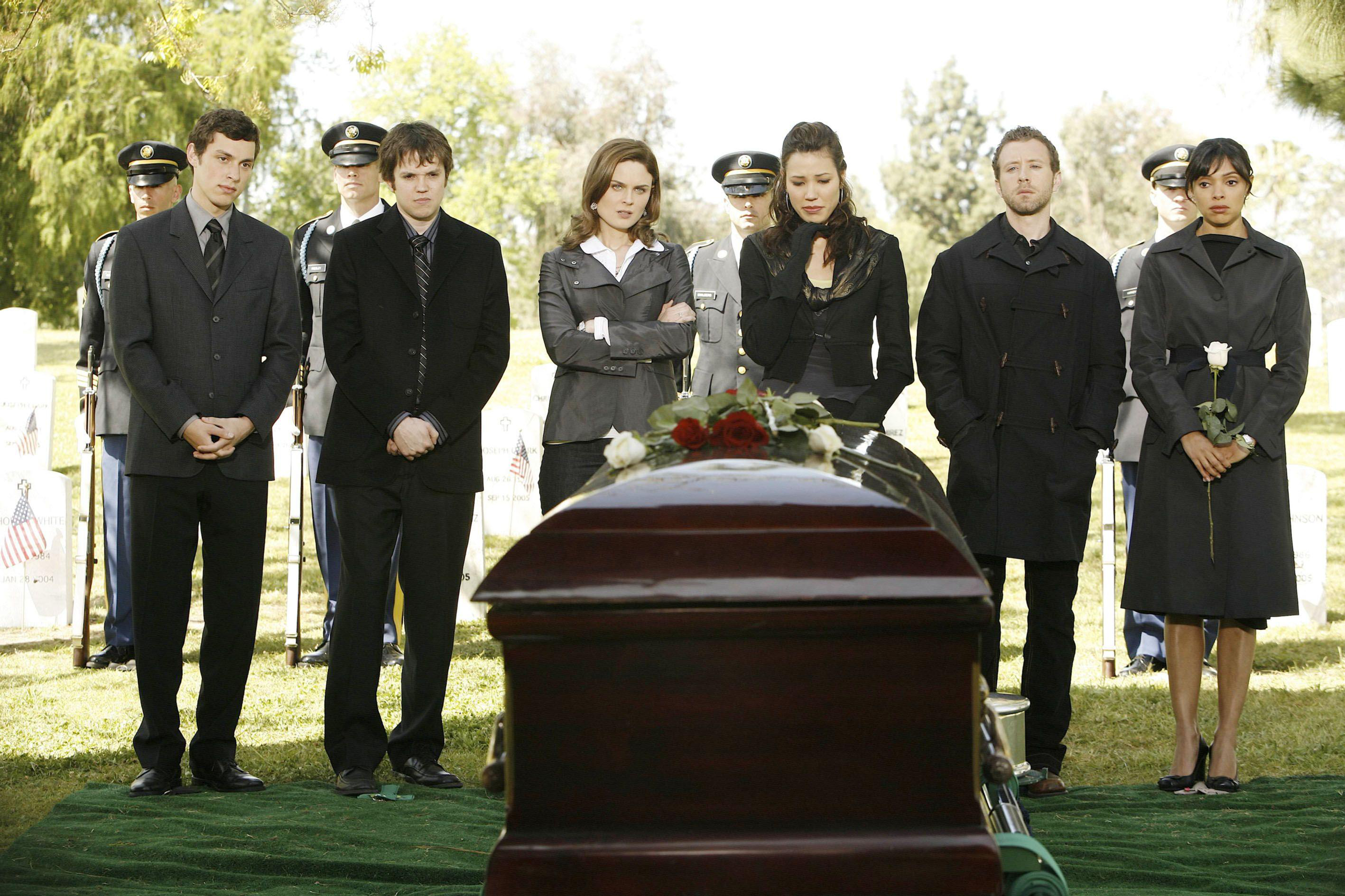 Funeral service with pallbearers and mourners HD Wallpaper