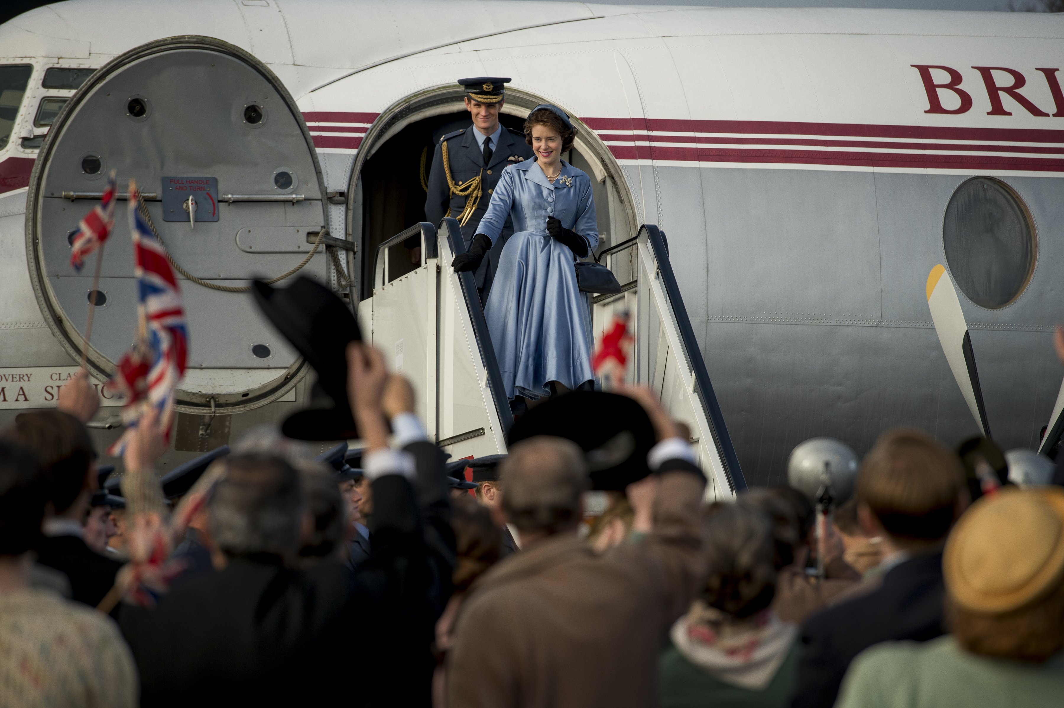 Queen Elizabeth II and an Air Force Officer disembarking from a plane HD Wallpaper