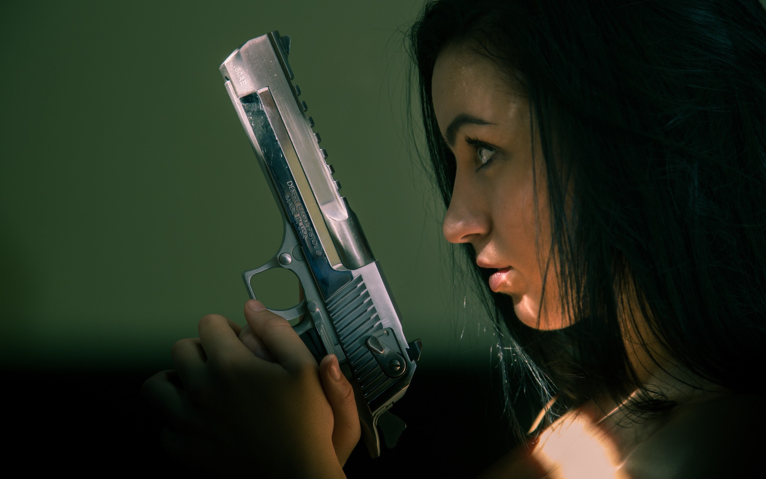 Woman holding a handgun HD Wallpaper