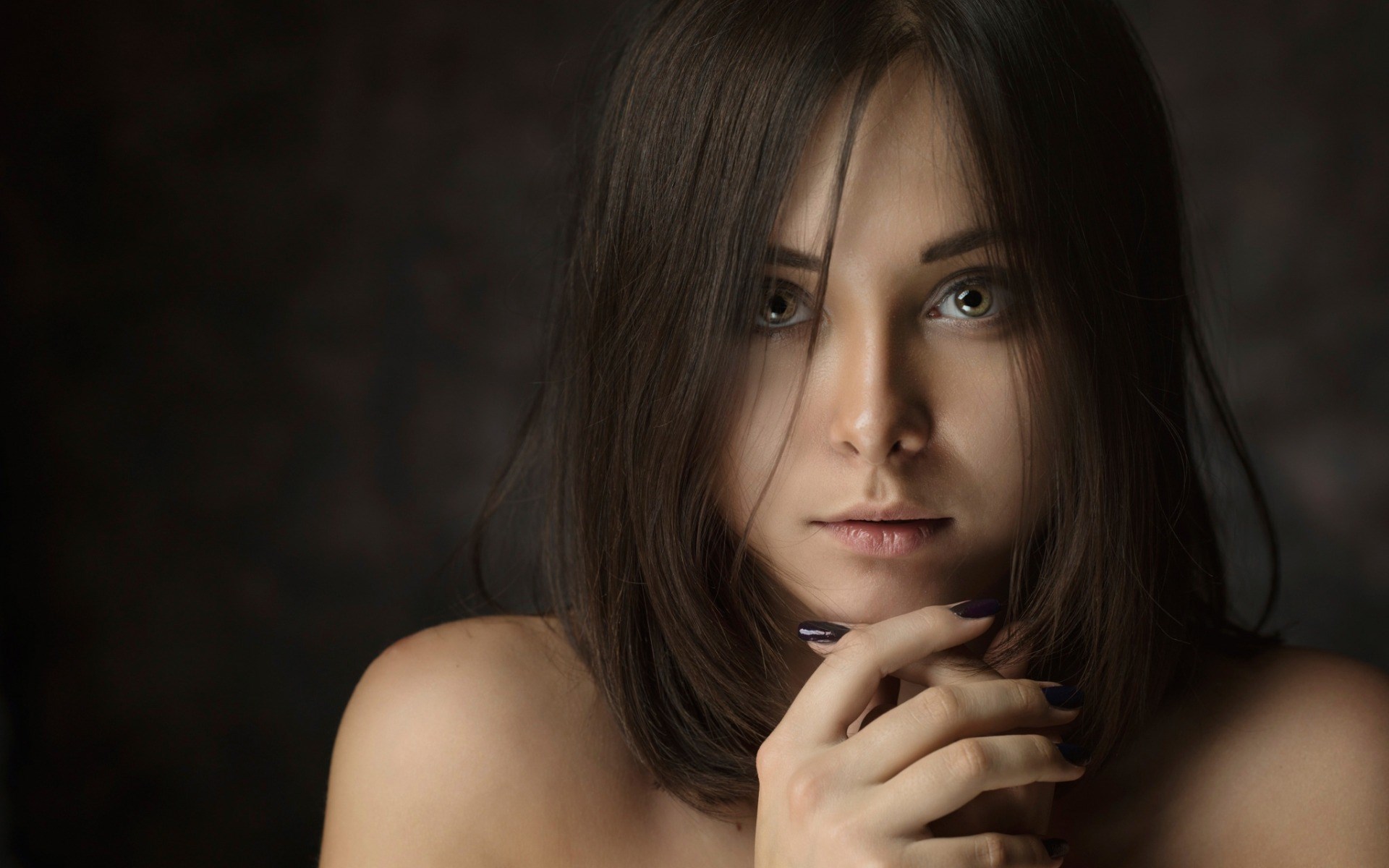 Woman with dark hair and light eyes HD Wallpaper