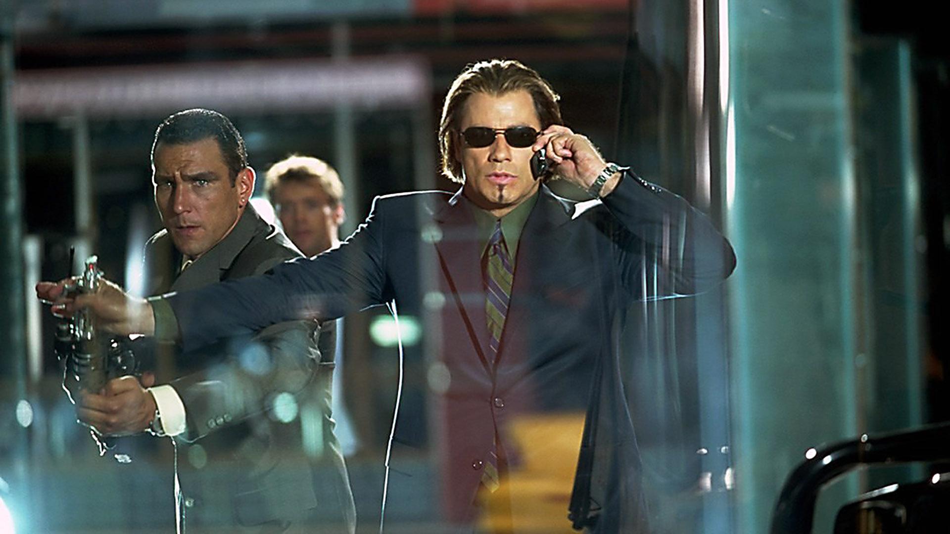 John Travolta and two men in suits HD Wallpaper
