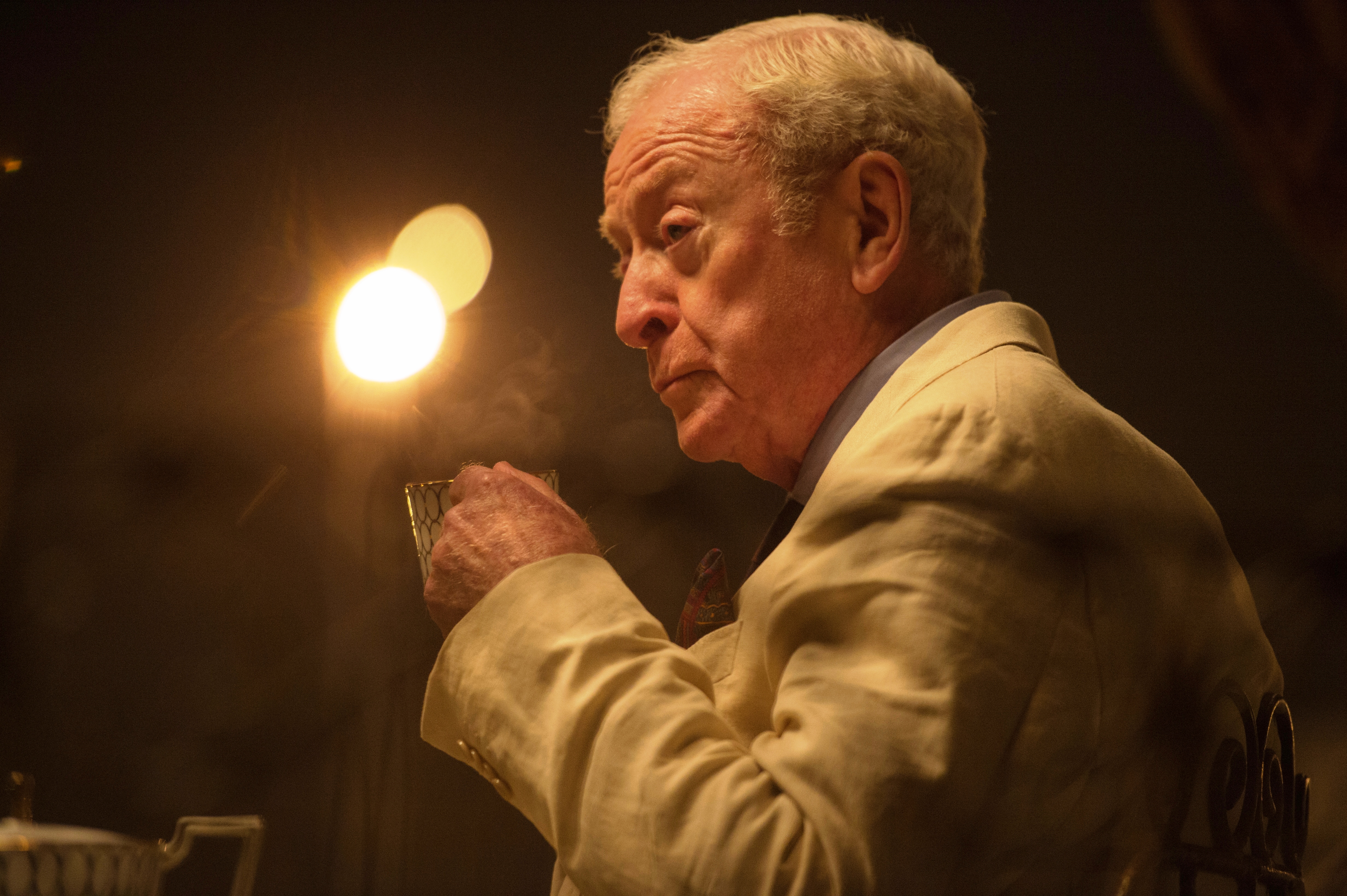 Michael Caine holding a glass HD Wallpaper
