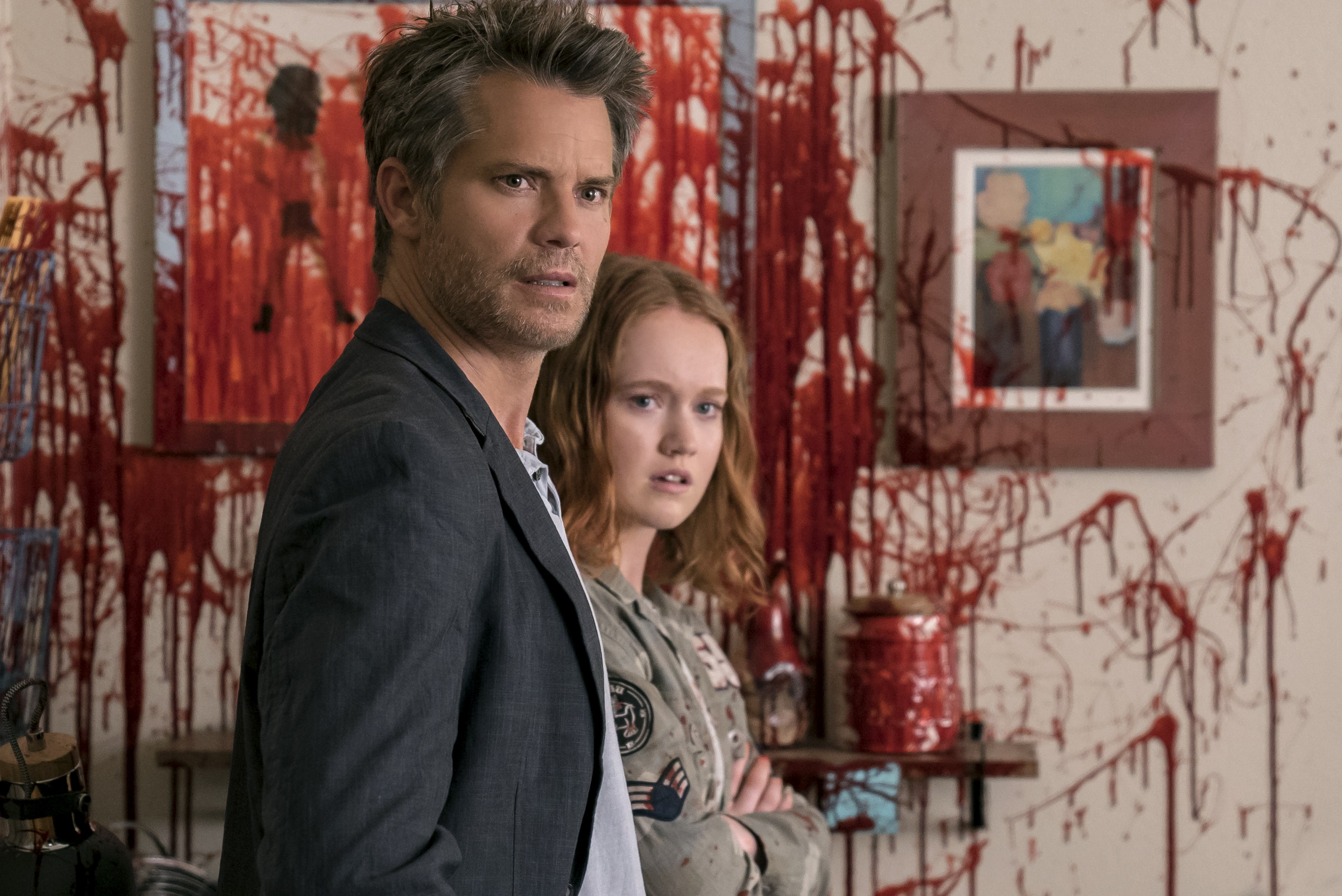 Timothy Olyphant and young woman in bloody room HD Wallpaper